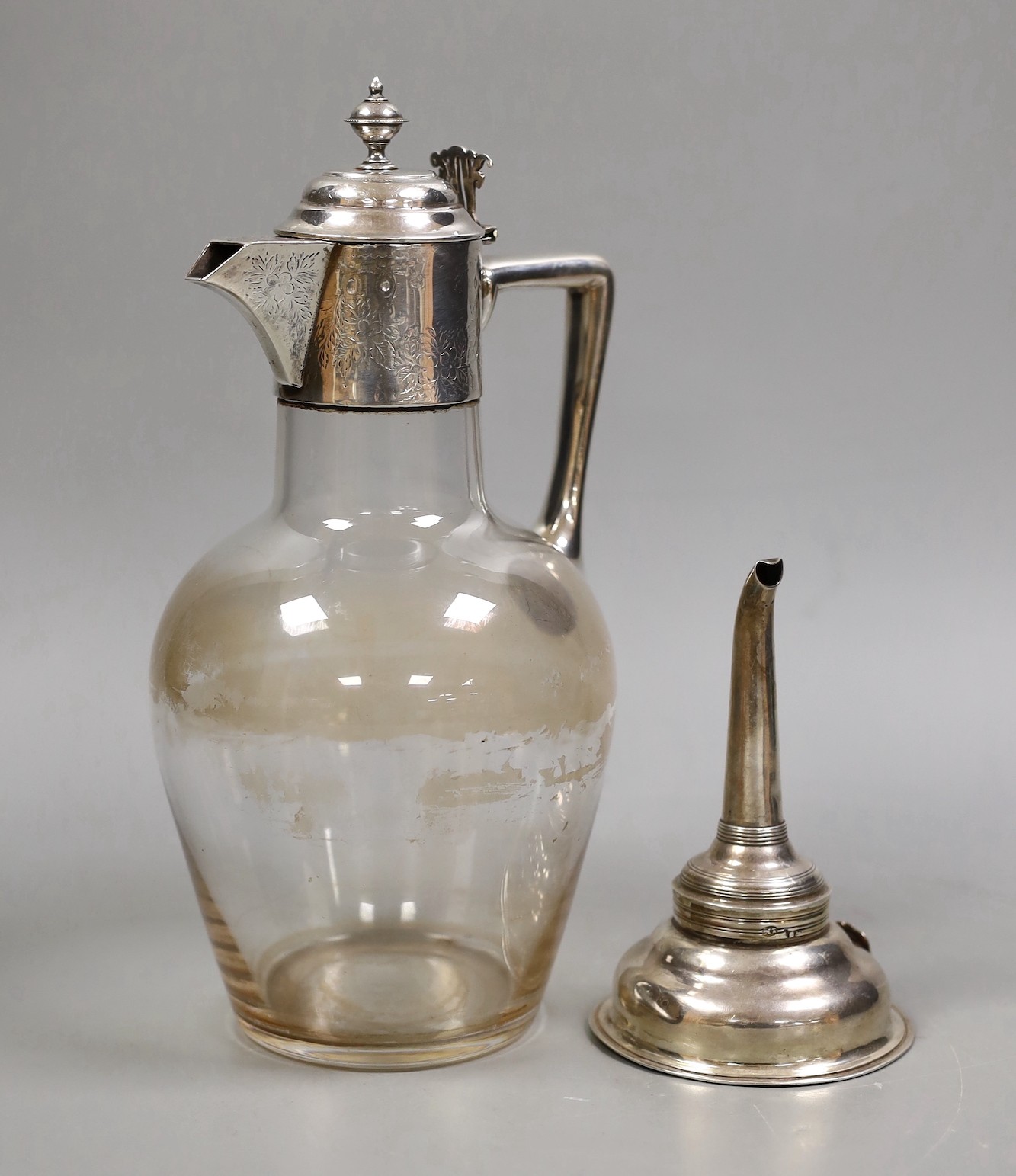 A George III silver wine funnel, James Mince, London, 1794, 12.5cm, together with a silver plate mounted glass claret jug.                                                                                                  