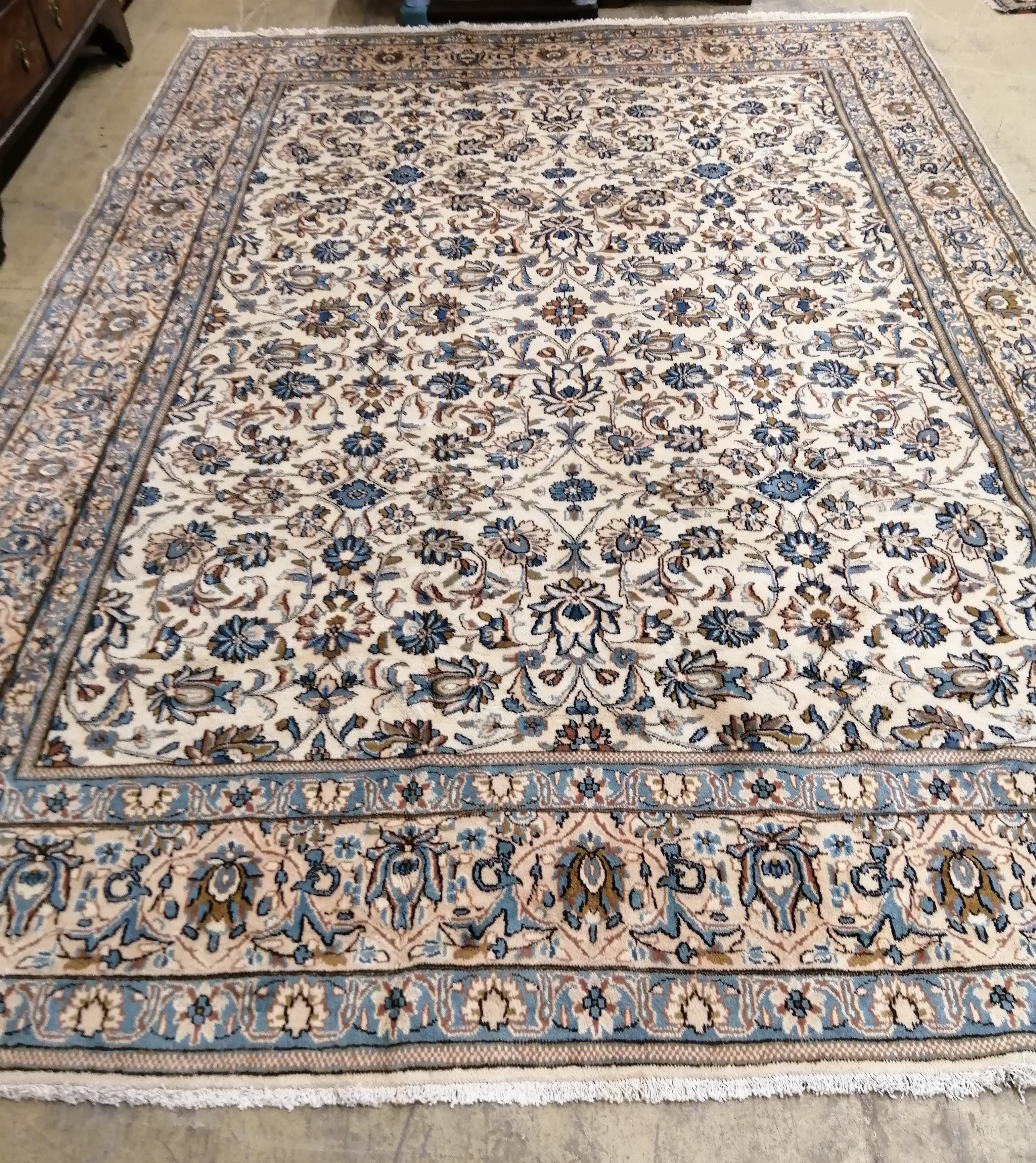 A Kashan ivory ground carpet, 342 x 242cm                                                                                                                                                                                   