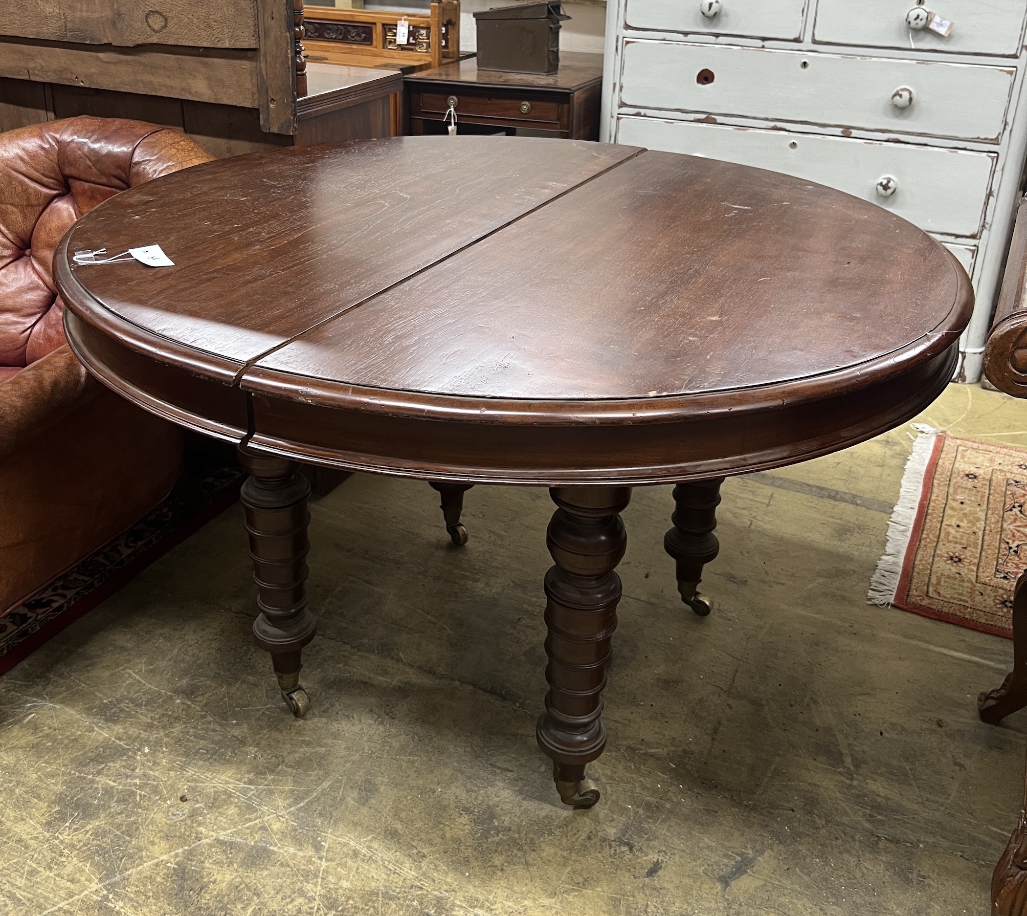 A 19th century and later Continental mahogany circular extending dining table, length approx. 270cm extended, three spare leaves, width 122cm, height 76cm                                                                  