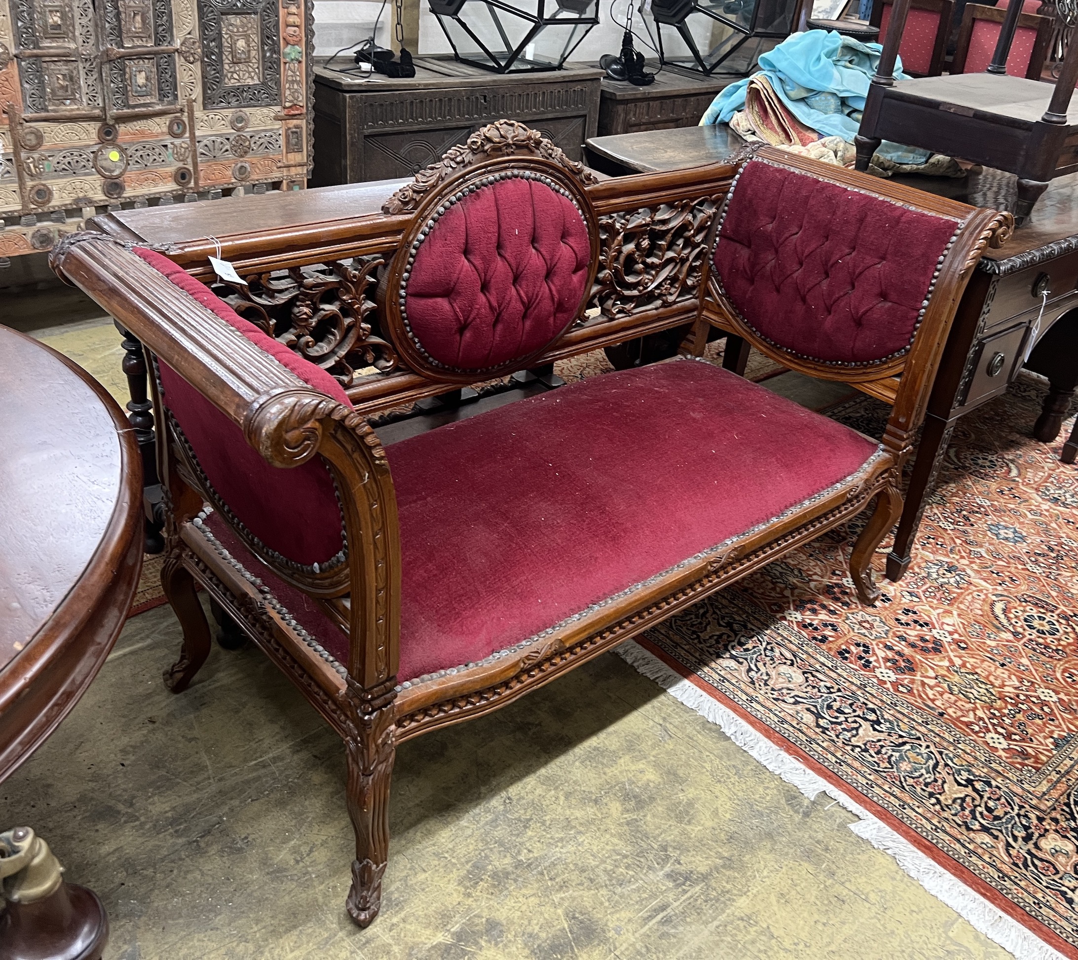 A Victorian style carved mahogany settee, length 156cm, depth 61cm, height 96cm                                                                                                                                             