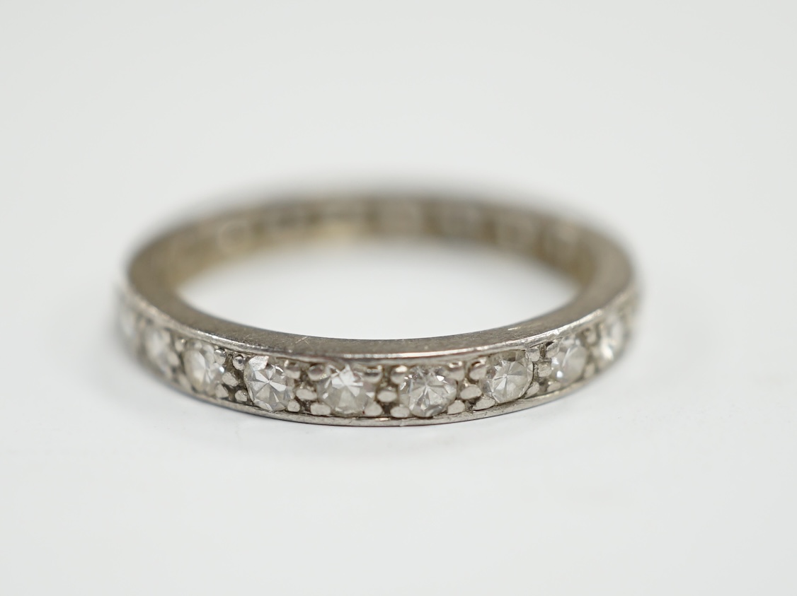 A white metal and diamond set full eternity ring, size M, gross weight 2.9 grams.                                                                                                                                           