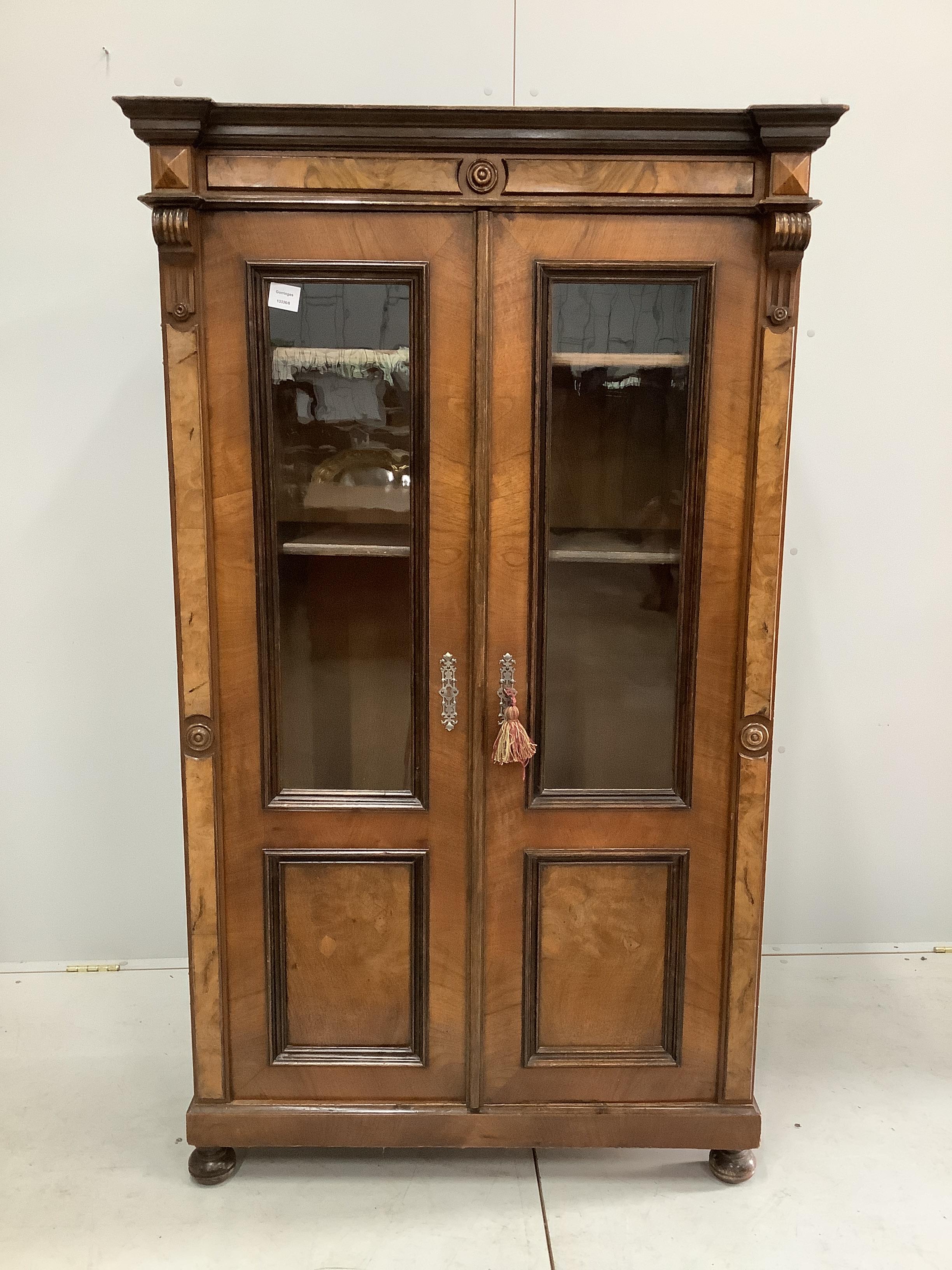 A 19th century French glazed walnut bookcase, width 92cm, depth 42cm, height 156cm                                                                                                                                          