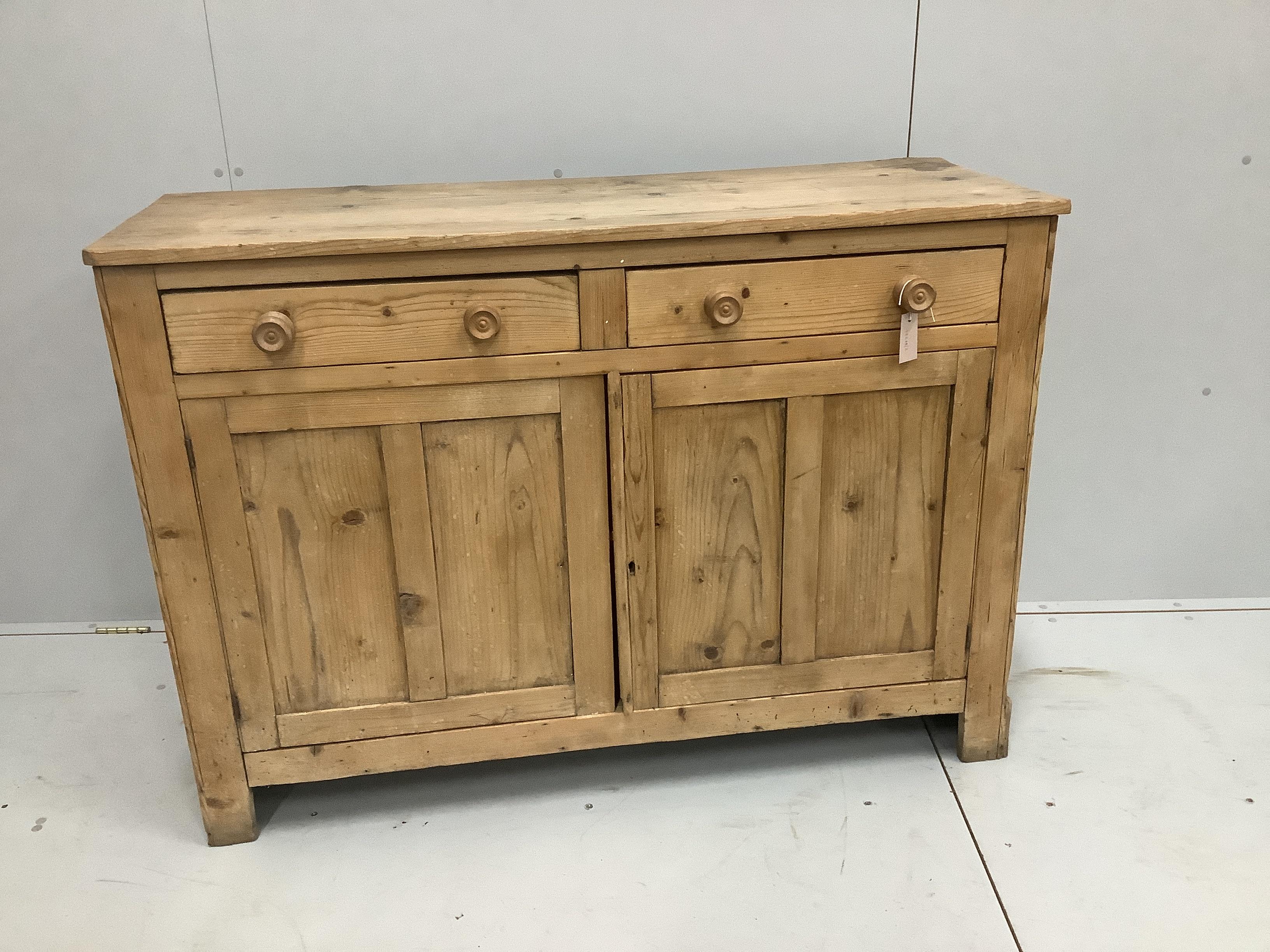 An Edwardian pine side cupboard, width 128cm, height 92cm                                                                                                                                                                   