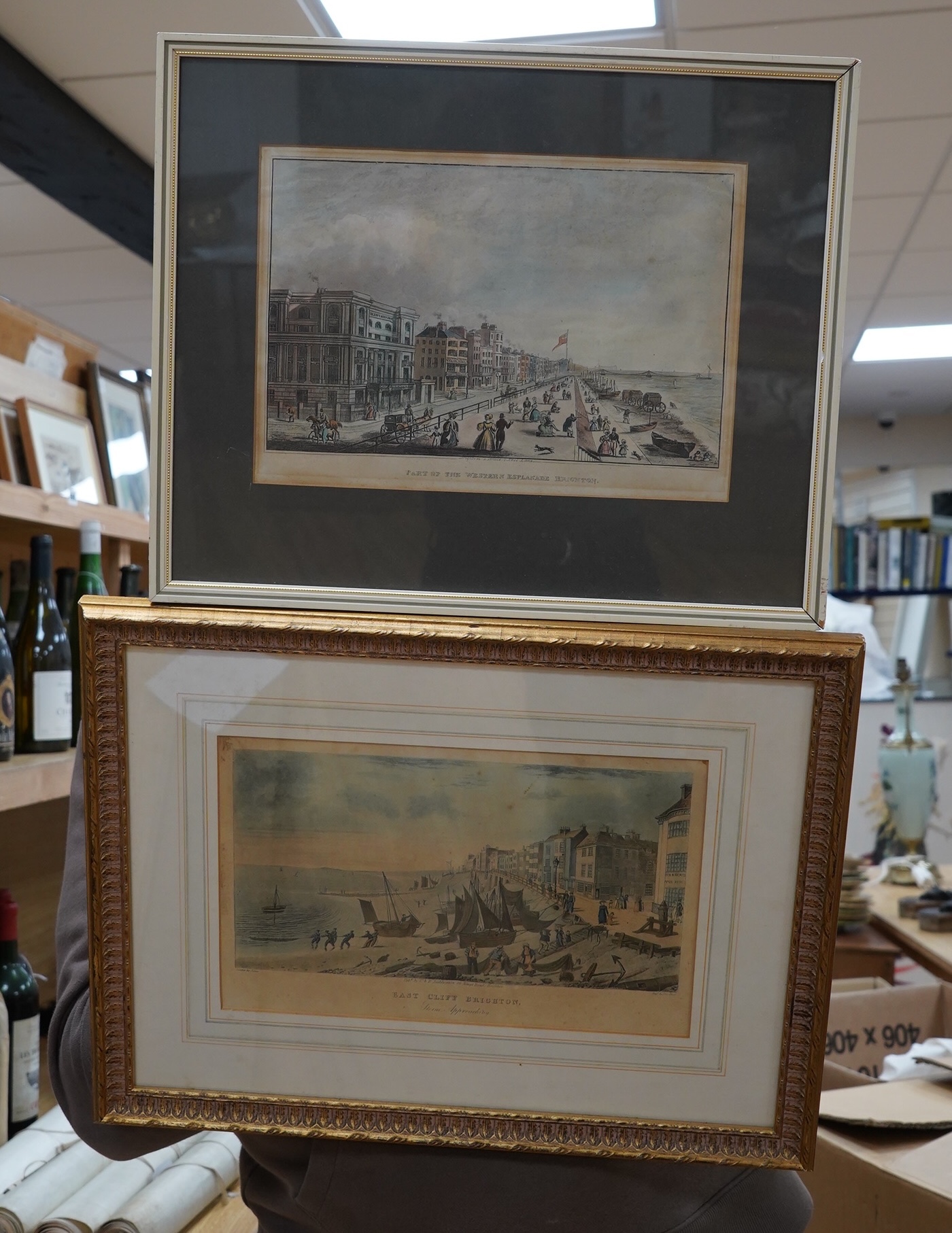19th century, two colour engravings, Brighton views comprising ‘Part of the Western Esplanade’ and ‘East Cliff, Brighton, Storm approaching’, published by C & R Sigmore, largest 19 x 29cm. Condition - fair               