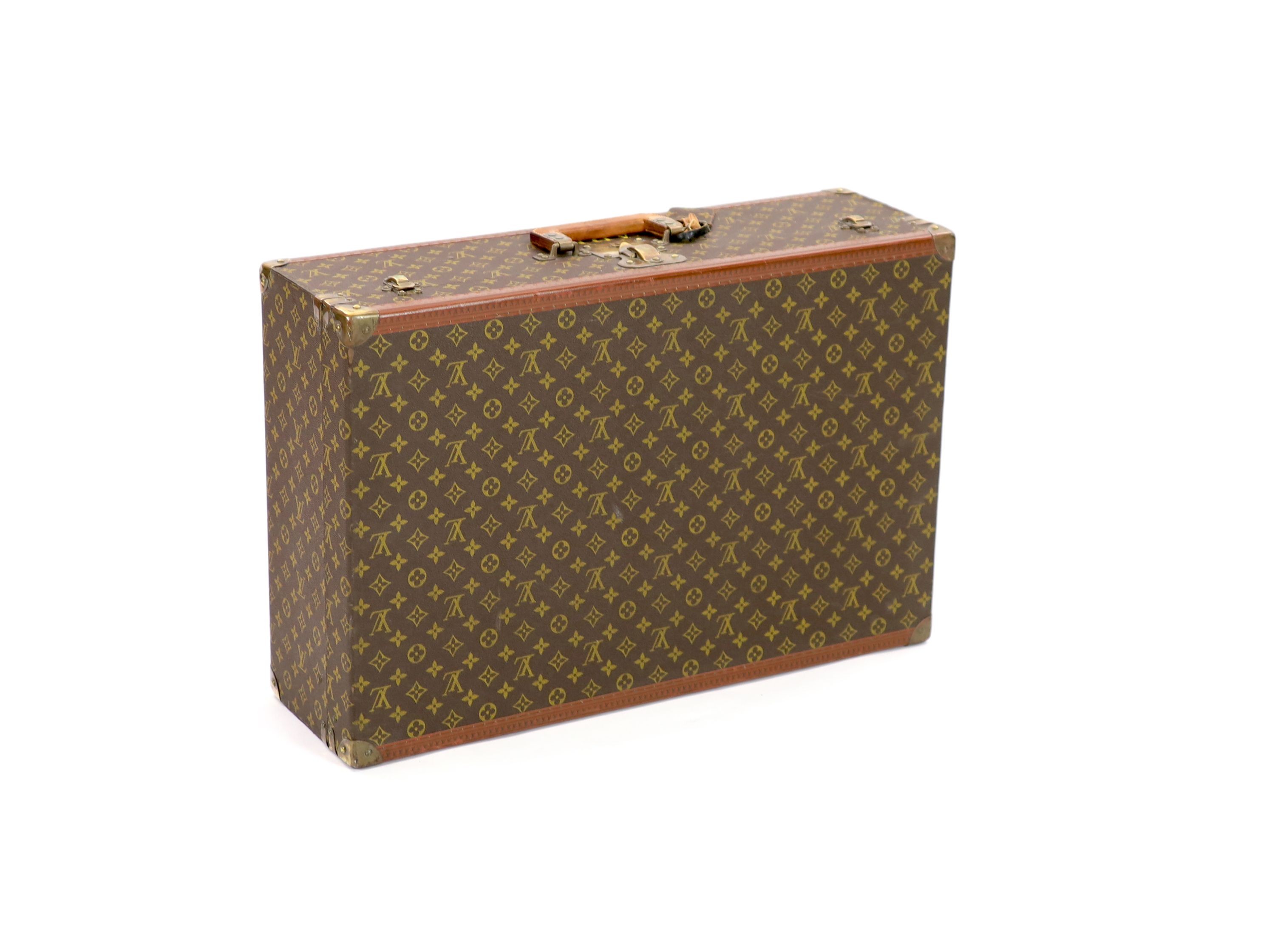 A Louis Vuitton LV pattern suitcase 70 x 47 x 22cm                                                                                                                                                                          