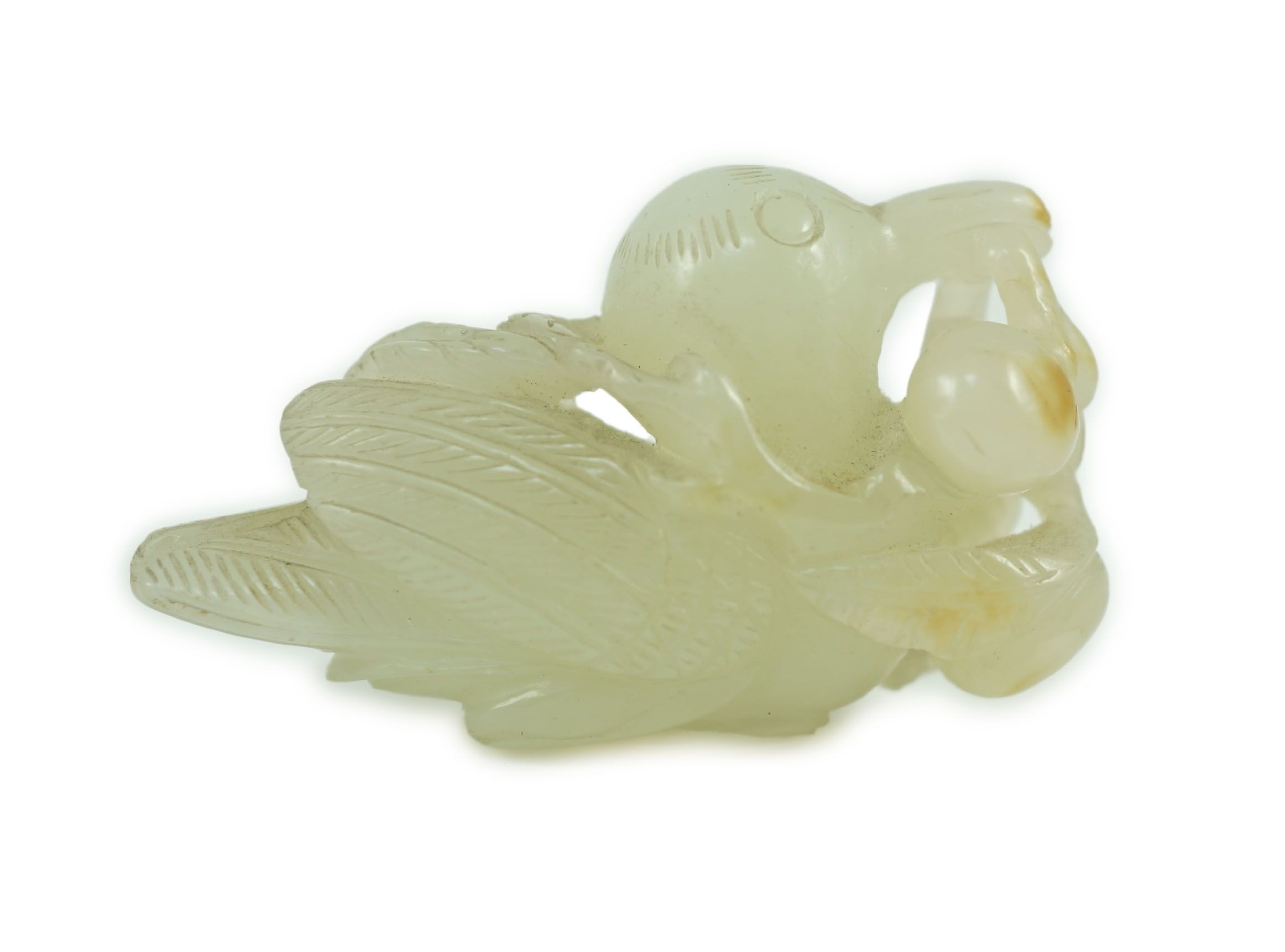 A Chinese pale celadon jade figure of a bird grasping a fruit sprig, 18th/19th century, 5.1 cm long                                                                                                                         