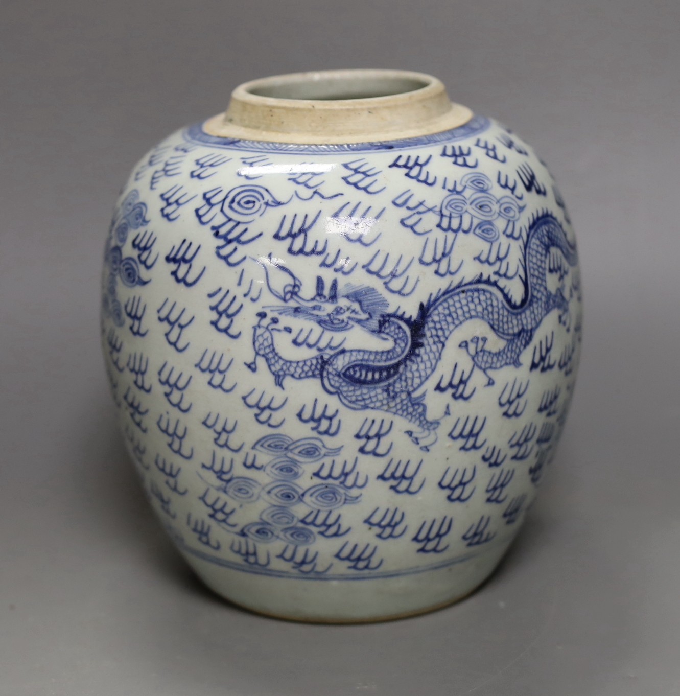 An 18th century Chinese provincial blue and white ‘dragon and phoenix’ jar, 19cm                                                                                                                                            