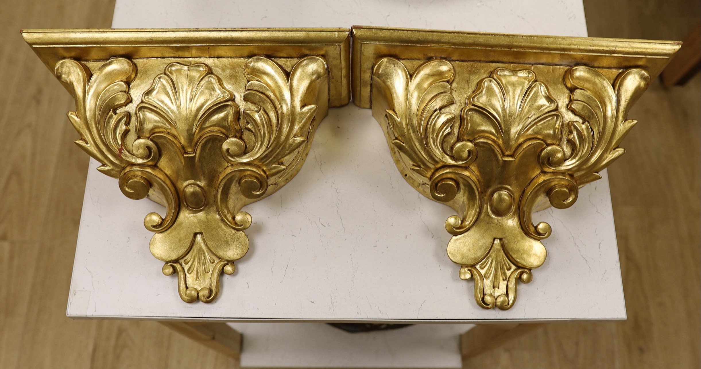 A pair of gilt wood wall brackets                                                                                                                                                                                           