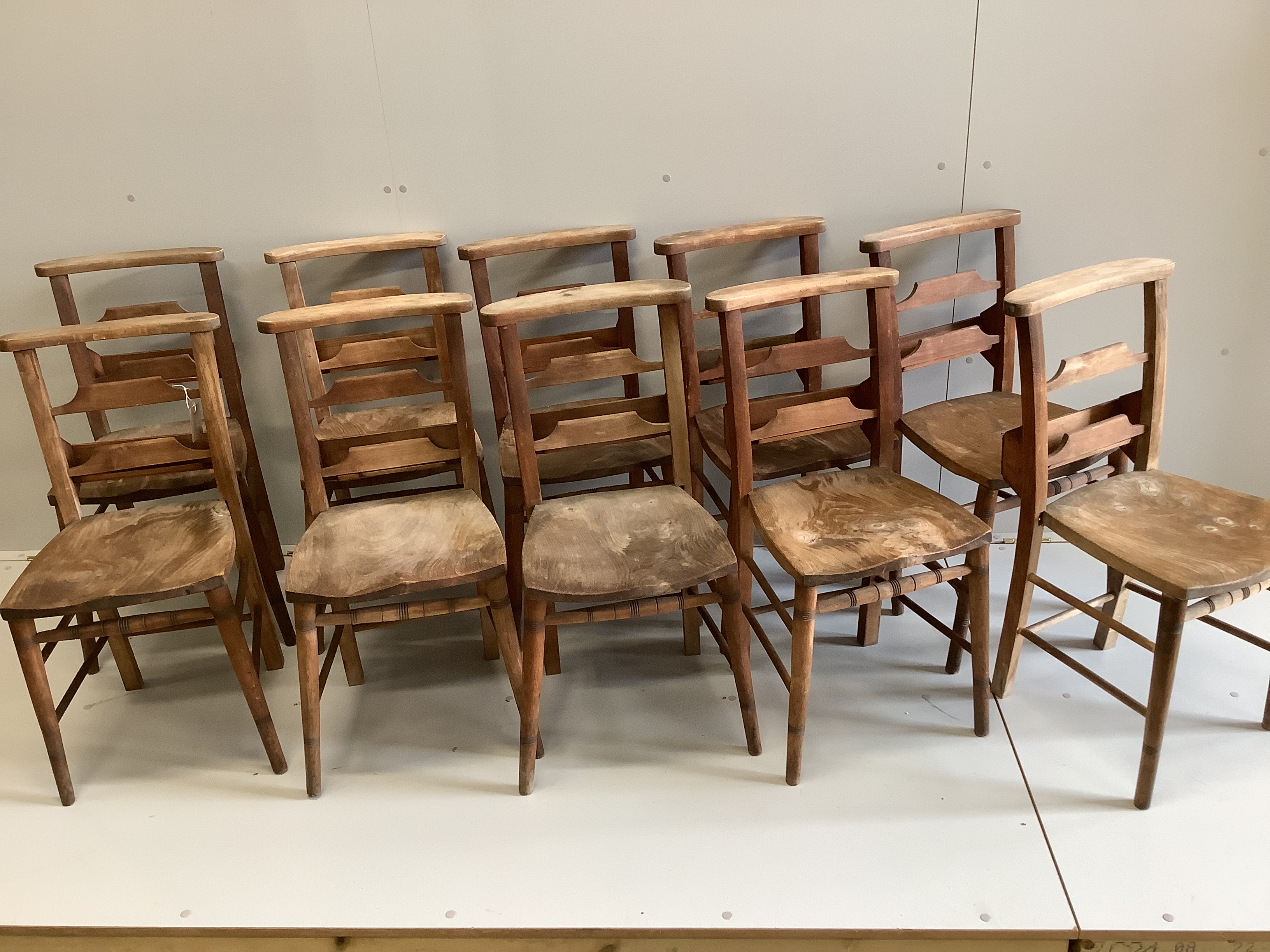 A set of ten elm and beech chapel chairs, width 35cm, depth 39cm, height 80cm                                                                                                                                               