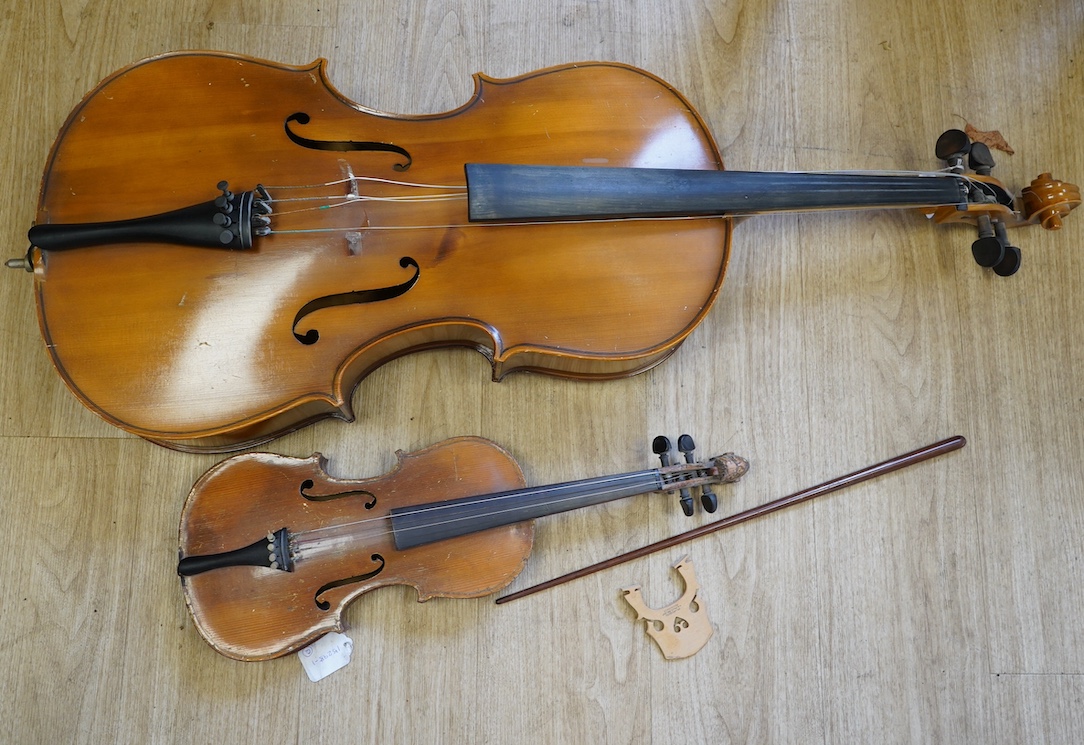 A student’s Golden Strad ‘cello imported by Boosey and Hawkes, body 69.5cm and violin, body 36cm, and a wooden conductors baton. Condition - poor to fair                                                                   