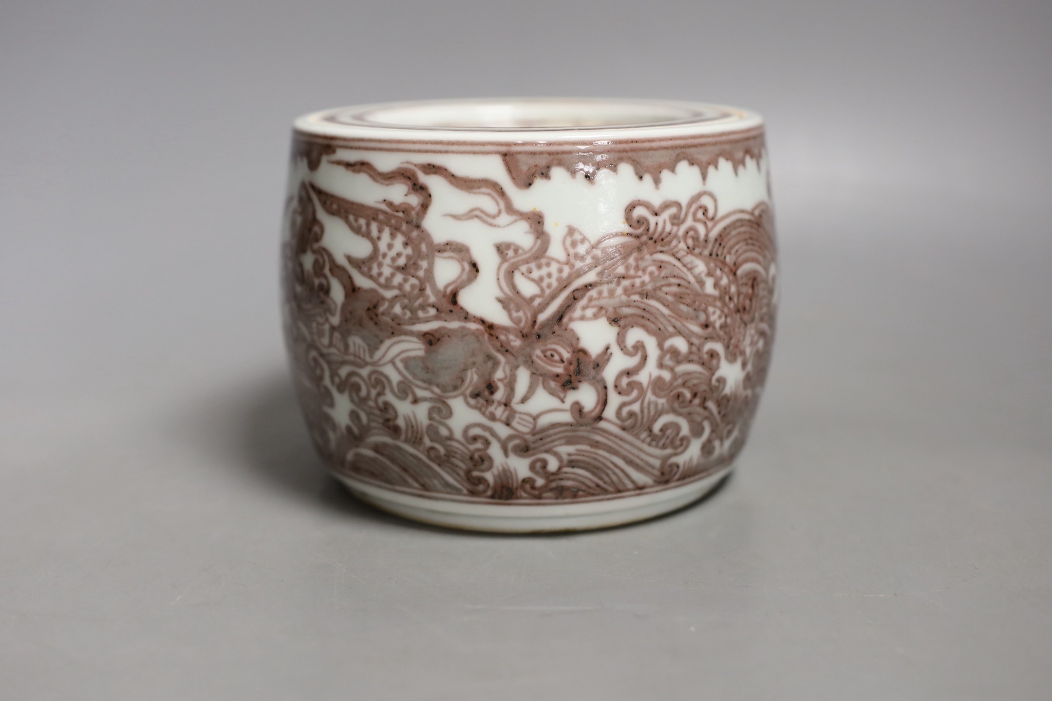 A Chinese iron-red underglaze jar and cover-10 cms high.                                                                                                                                                                    