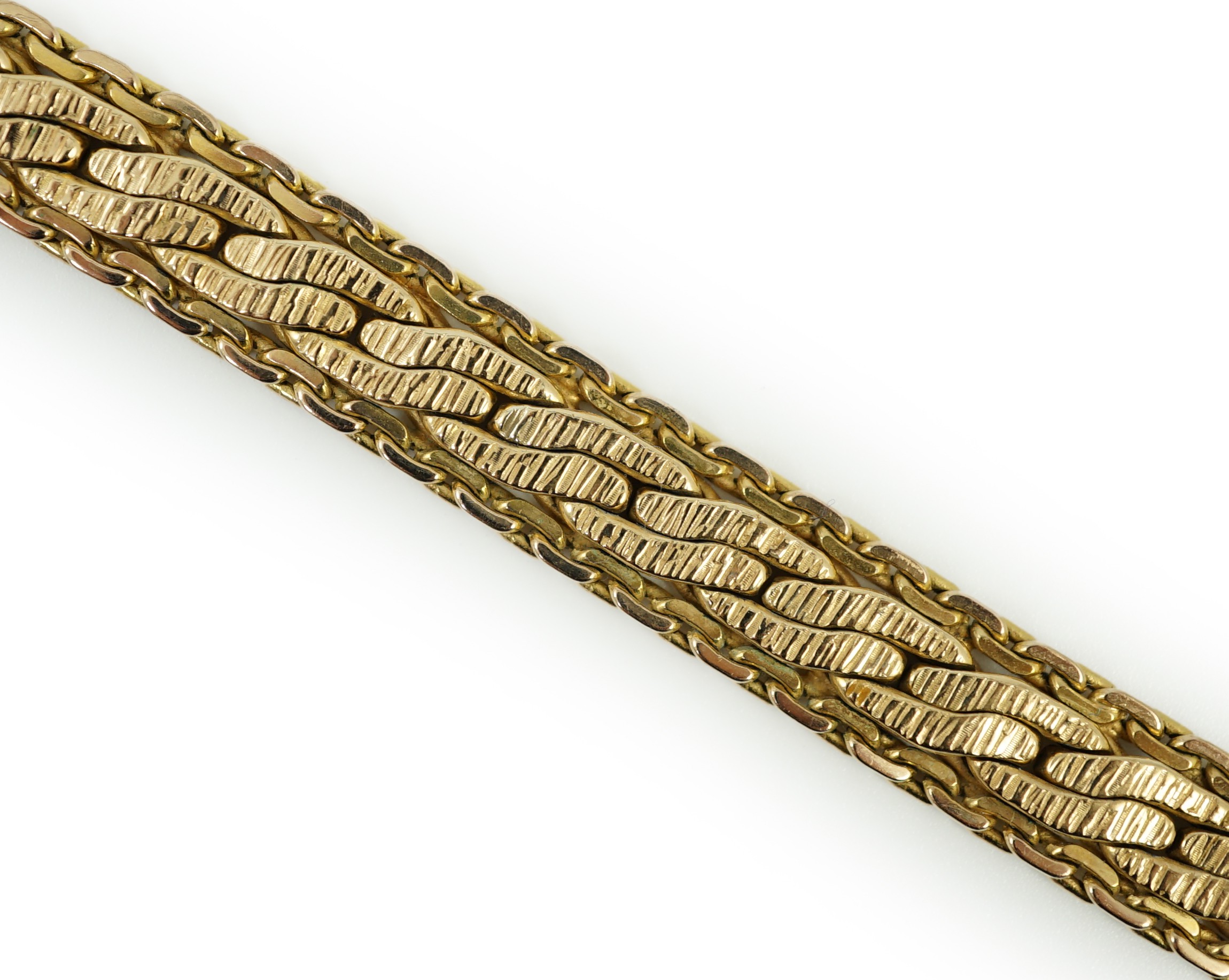 A modern Italian Uno-A-Erre 9ct gold bracelet, 19cm, (repair), 22.2 grams.                                                                                                                                                  