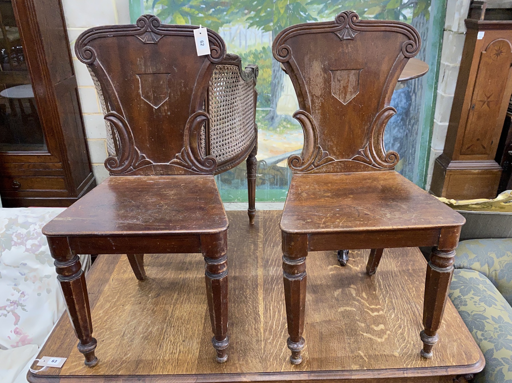 A pair of Victorian mahogany hall chairs, width 42cm, height 88cm                                                                                                                                                           