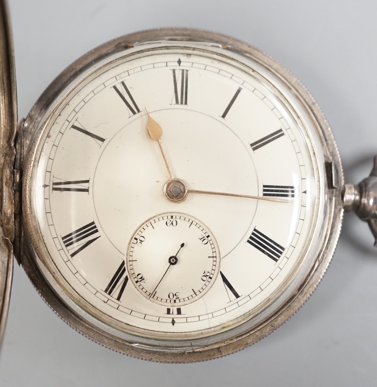 A Victorian silver hunter keywind pocket watch, with Roman dial and subsidiary seconds, by Robert Reid, Bristol, with key.                                                                                                  
