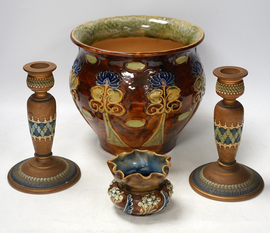 A Doulton Lambeth jardiniere, a small bowl and a pair of siliconware candlesticks, largest 18cm high. Condition - poor                                                                                                      