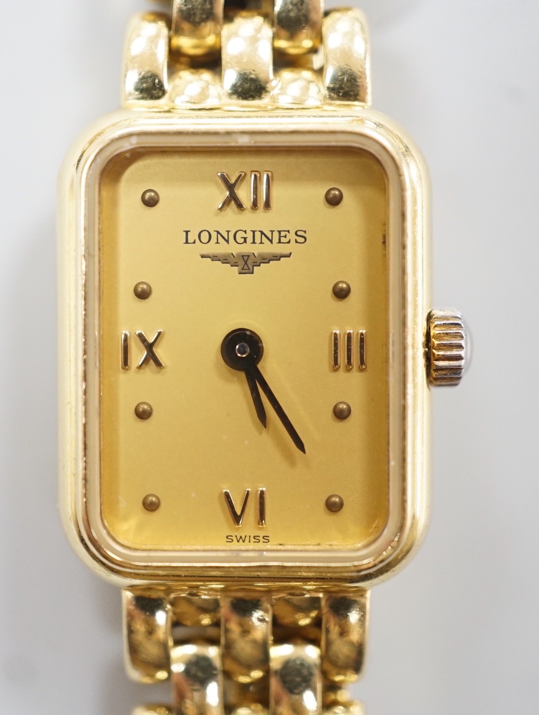 A lady's 2001 18ct gold Longines quartz wrist watch, with rectangular part Roman dial, on 18ct gold Longines bracelet, with original receipt and papers, no box                                                             