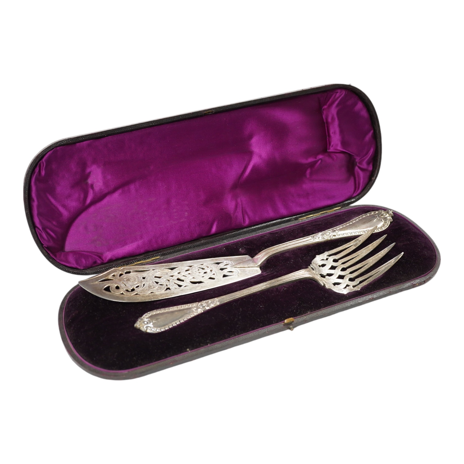 A cased pair of Victorian silver fish servers, by George Adams, indistinct marks, knife 32.7cm, 11oz. Condition - fair                                                                                                      