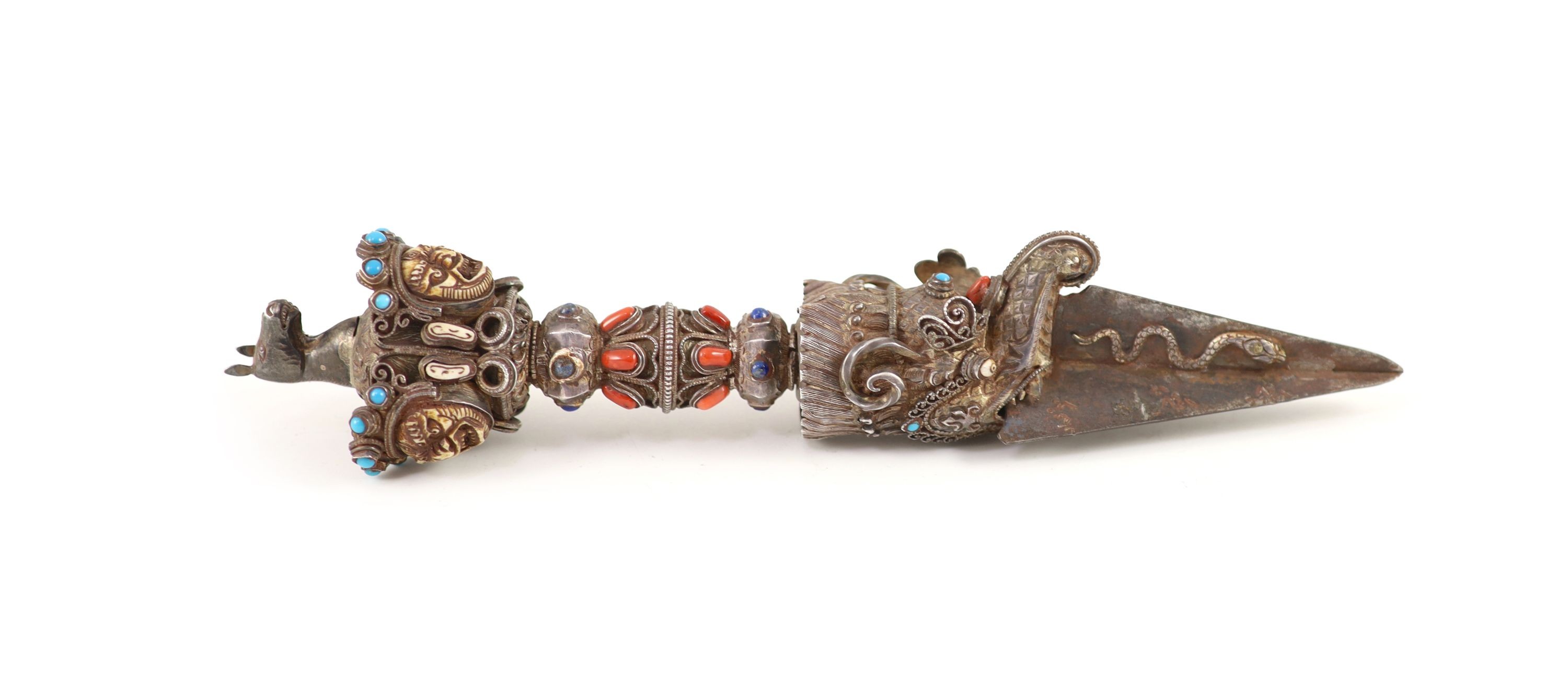 A Tibetan silver, bone and gem set phurbu (ritual dagger), 19th/20th century, 27.5 cm long, some of the stones replaced with glass                                                                                          
