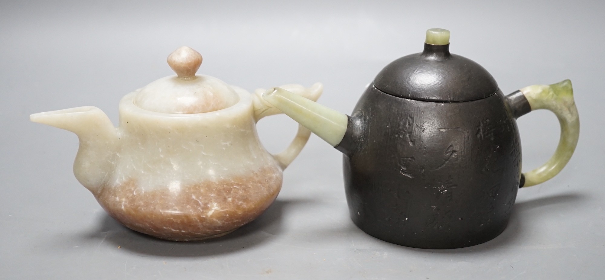 A Chinese jade wine pot and a Yixing pewter and bowenite jade mounted tea pot (2)                                                                                                                                           