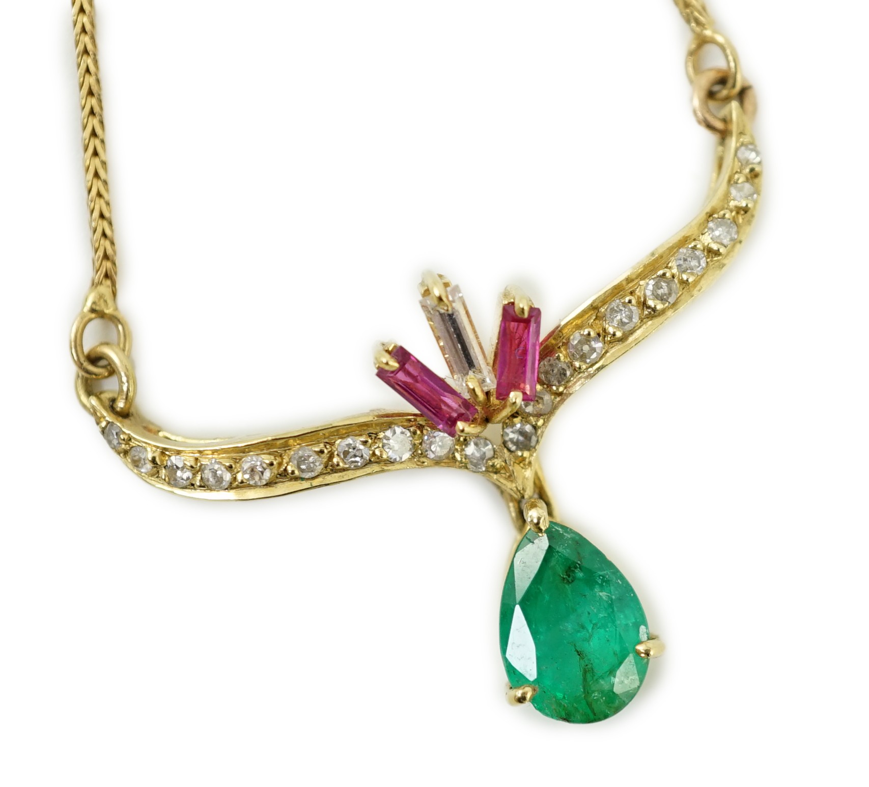 A modern Italian 750 yellow metal, emerald, ruby and diamond cluster set drop pendant, pendant width 35mm, chain 34mm, gross weight 7.3 grams.                                                                              
