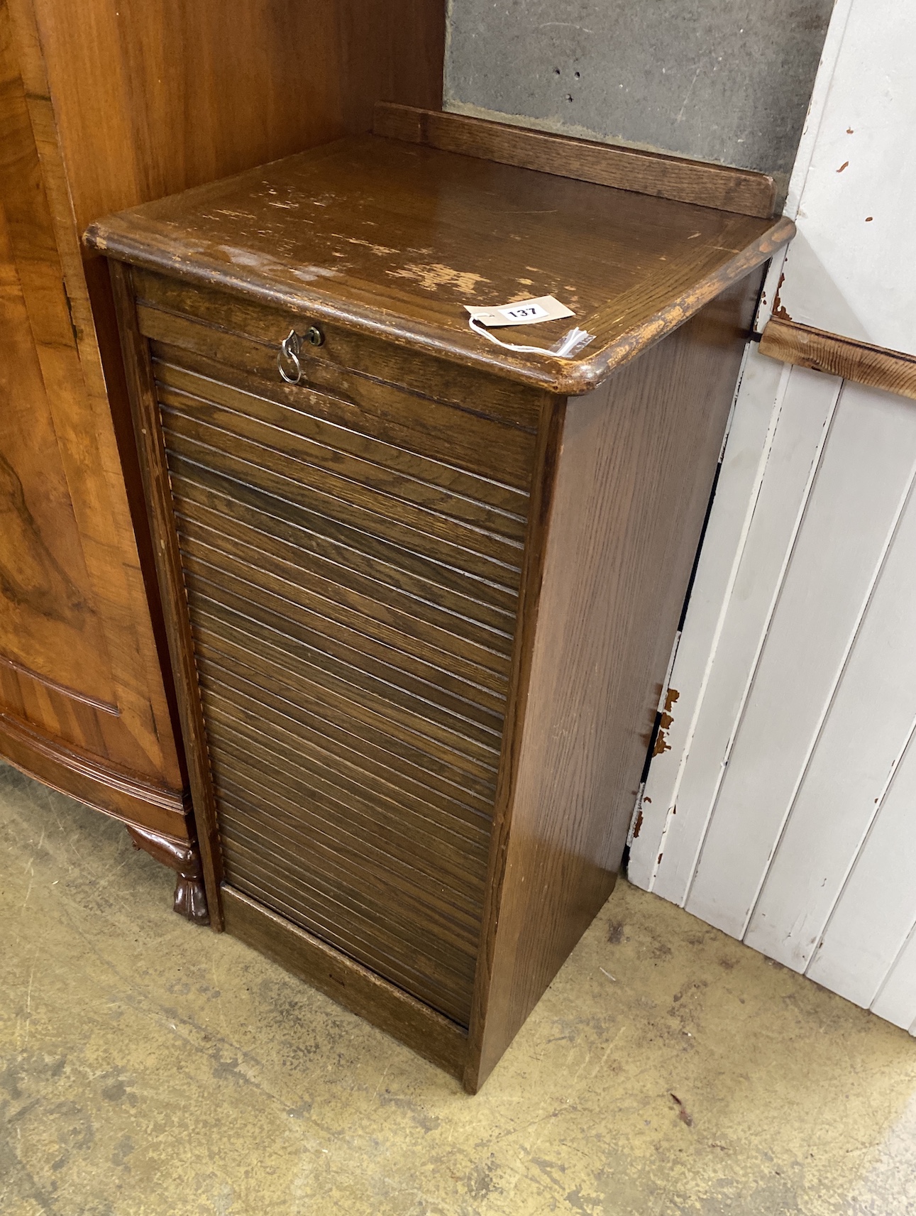 A mid century oak tambour filing cabinet, width 46cm, depth 40cm, height 93cm                                                                                                                                               