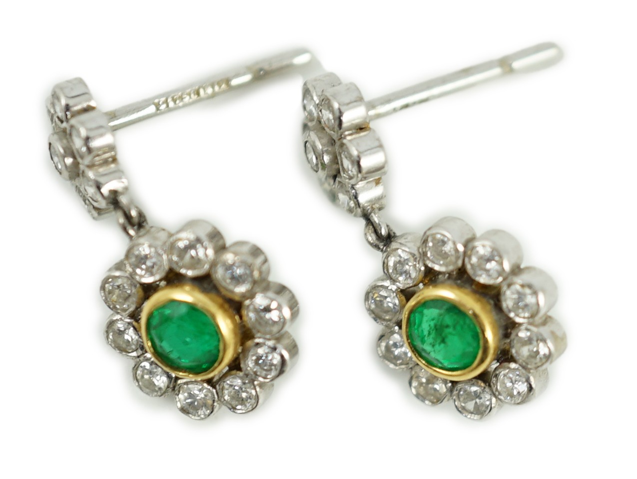 A modern pair of 18ct white gold, emerald and diamond cluster set drop earrings, 16mm, gross weight 3 grams.                                                                                                                
