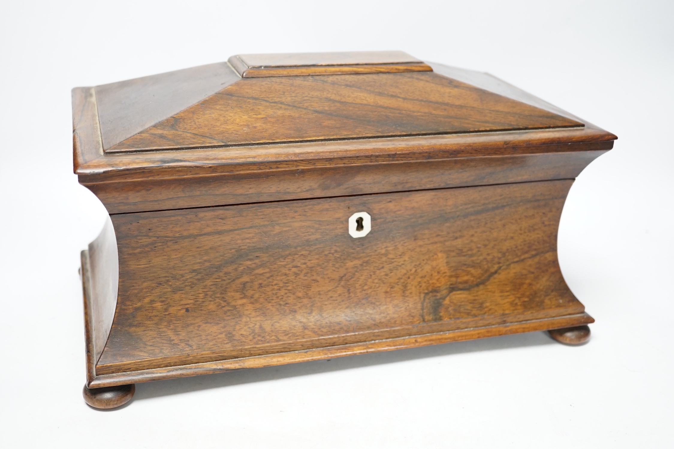 A William IV rosewood sarcophagus shaped tea caddy, 34cm wide CITES Submission reference QKX14SVV                                                                                                                           