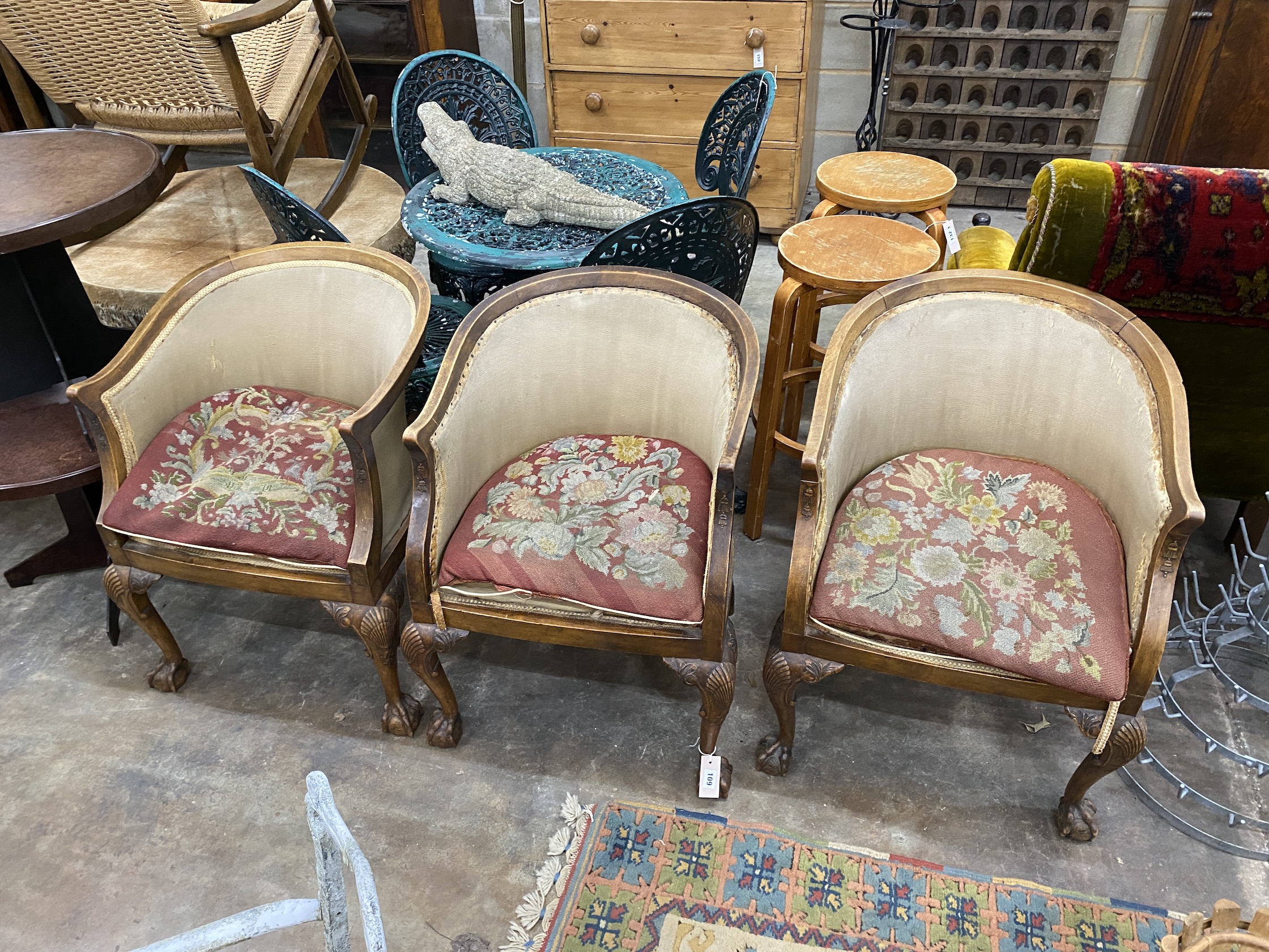A set of three Edwardian mahogany tub chairs, with show-wood frames and shell carved cabriole legs on claw and ball feet, (requiring upholstery), width 53cm, height 78cm, NB: From the Estate of Rt Hon Lord Lawson of Blab