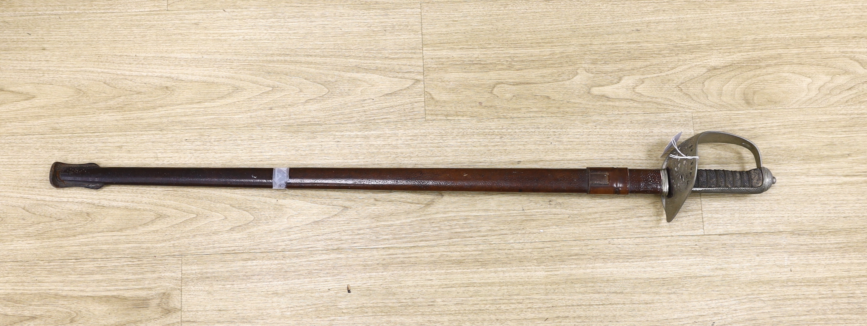 A George V officer's dress sword by Army & Navy Stores Ltd., blade 83cm, within leather scabbard                                                                                                                            