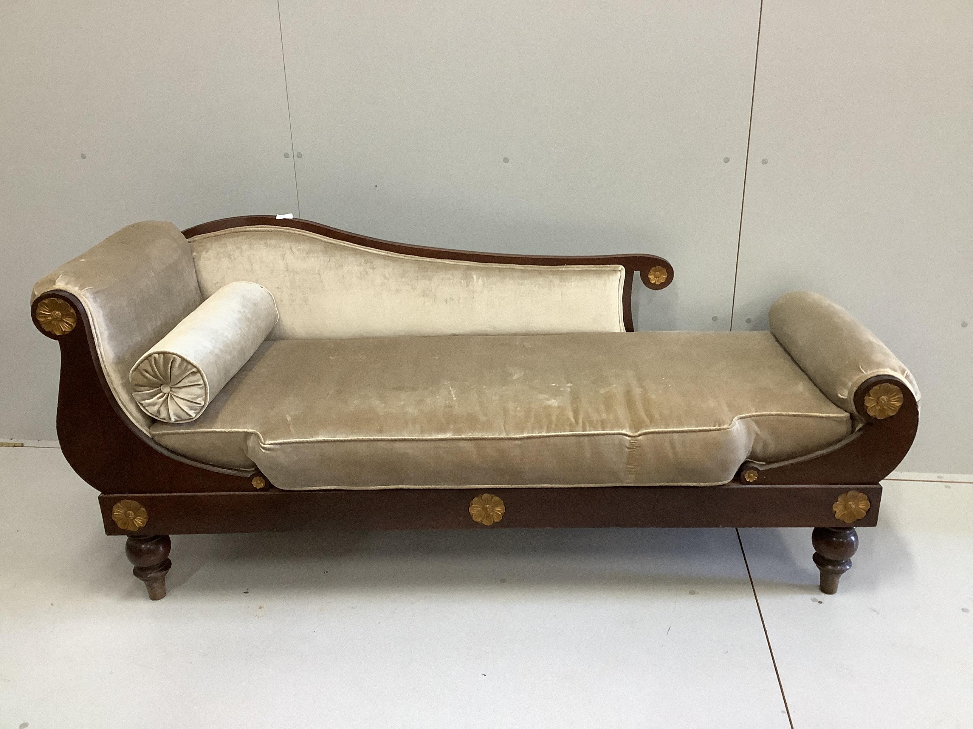 An Empire style mahogany chaise longue, width 180cm, depth 64cm, height 80cm                                                                                                                                                