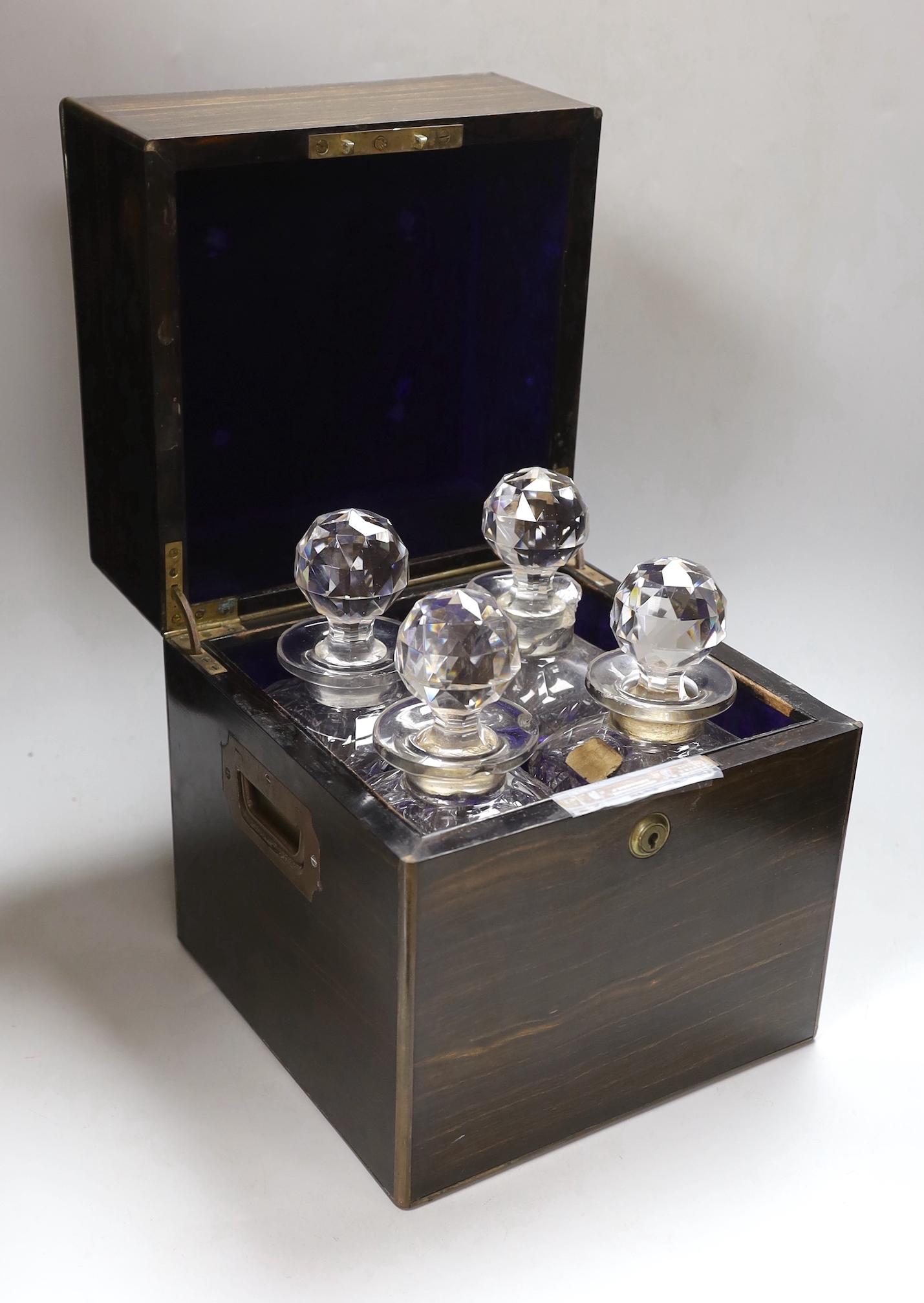 A Victorian coromandel cased and brass mounted four bottle decanter box, approx 28cm high x 25cm wide                                                                                                                       