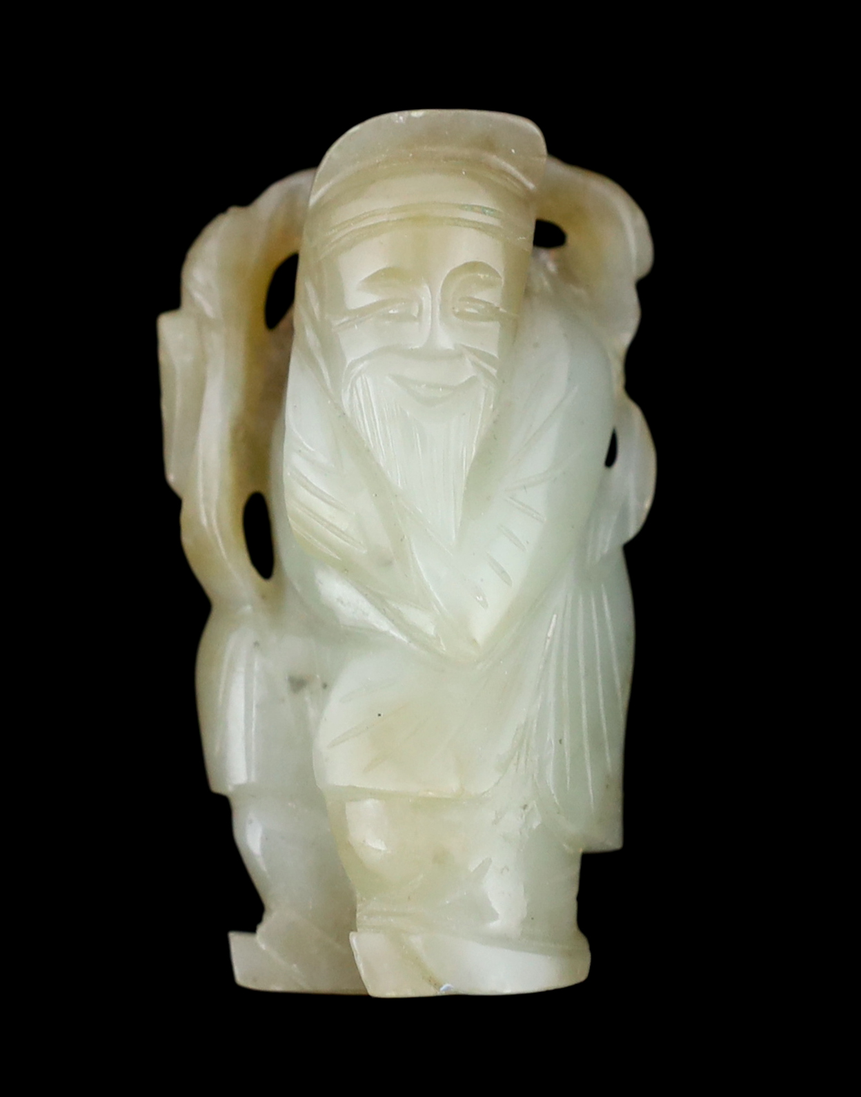 A Chinese pale celadon and russet jade figure of an old man, 18th / 19th century                                                                                                                                            
