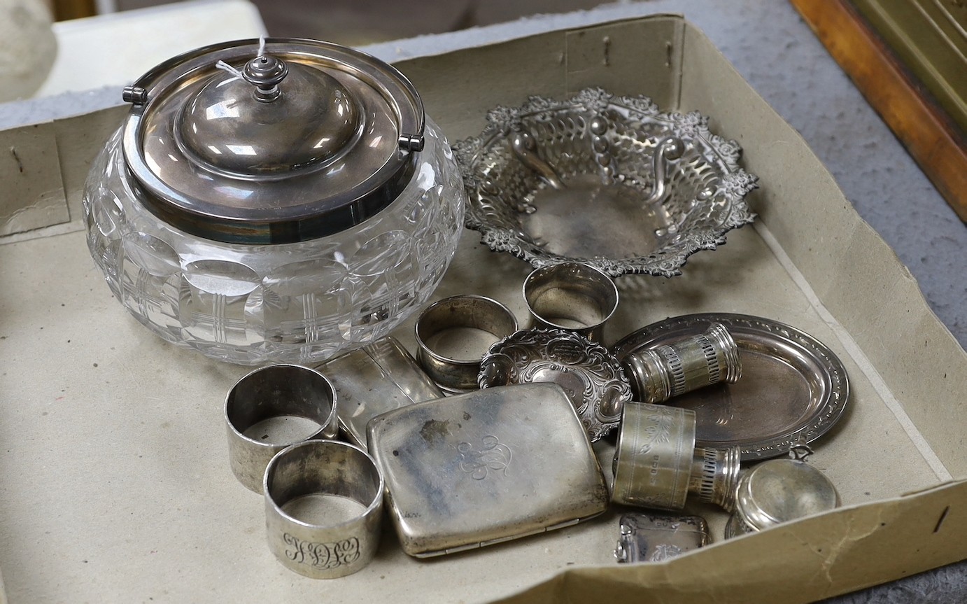 A George V silver mounted glass bowl and cover and other sundry silver including napkin rings, vesta case and condiments.                                                                                                   