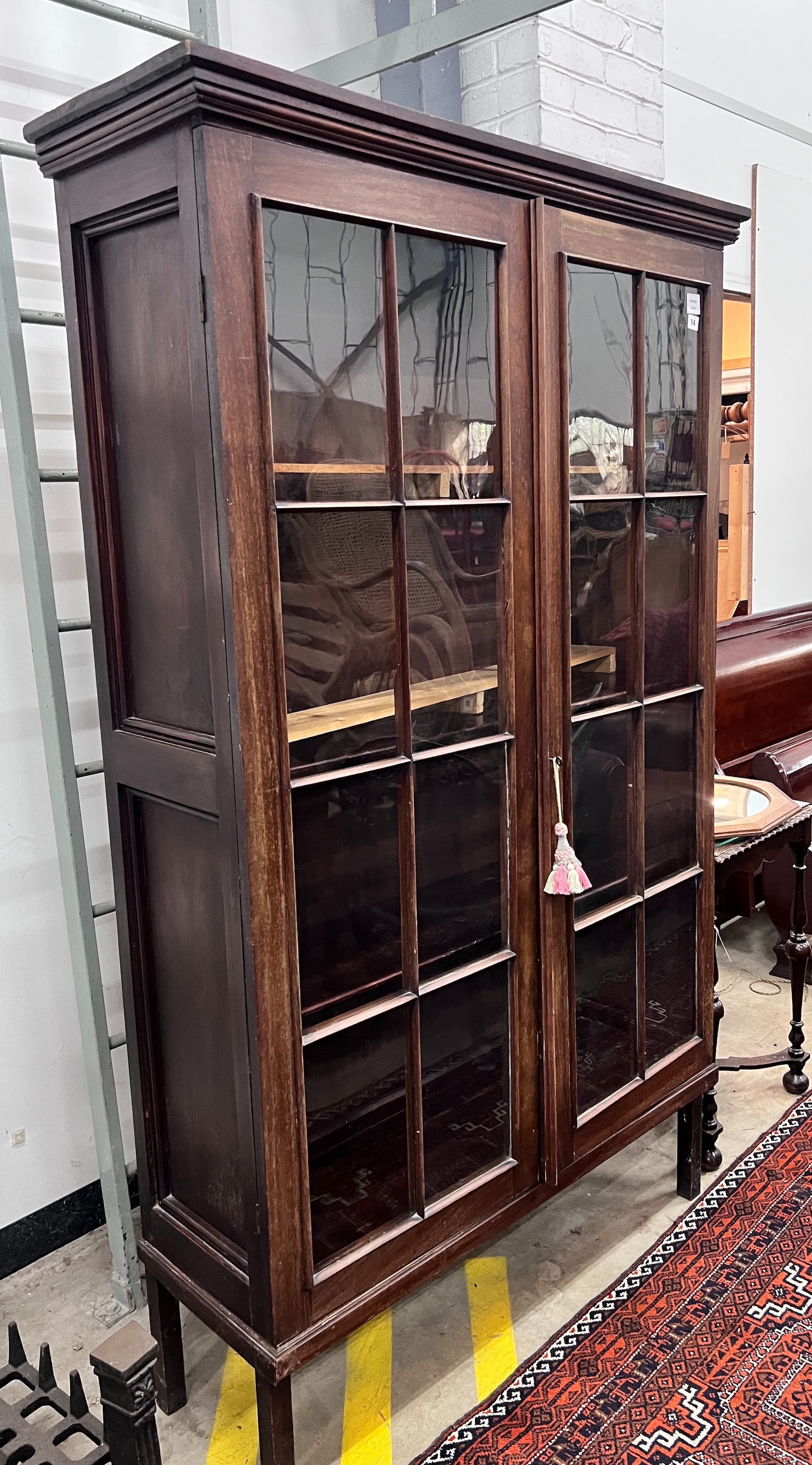 A George III mahogany glazed two door bookcase, width 112cm, depth 38cm, height 188cm, *Please note the sale commences at 9am.                                                                                              