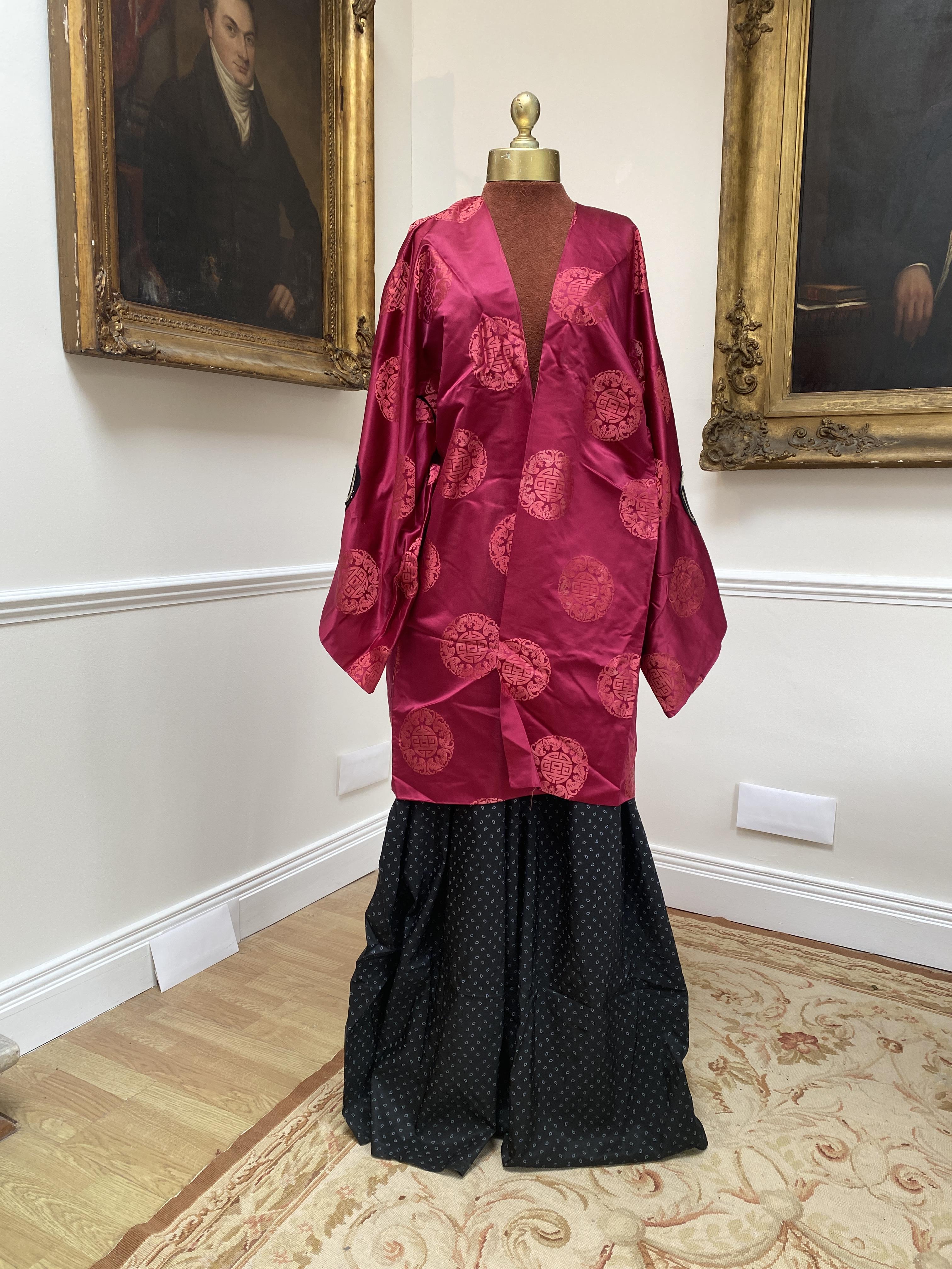 A Japanese men’s outfit (The Bonze – Madame Butterfly), black blouse and pantaloons and maroon silk tunic. Size M/L                                                                                                         