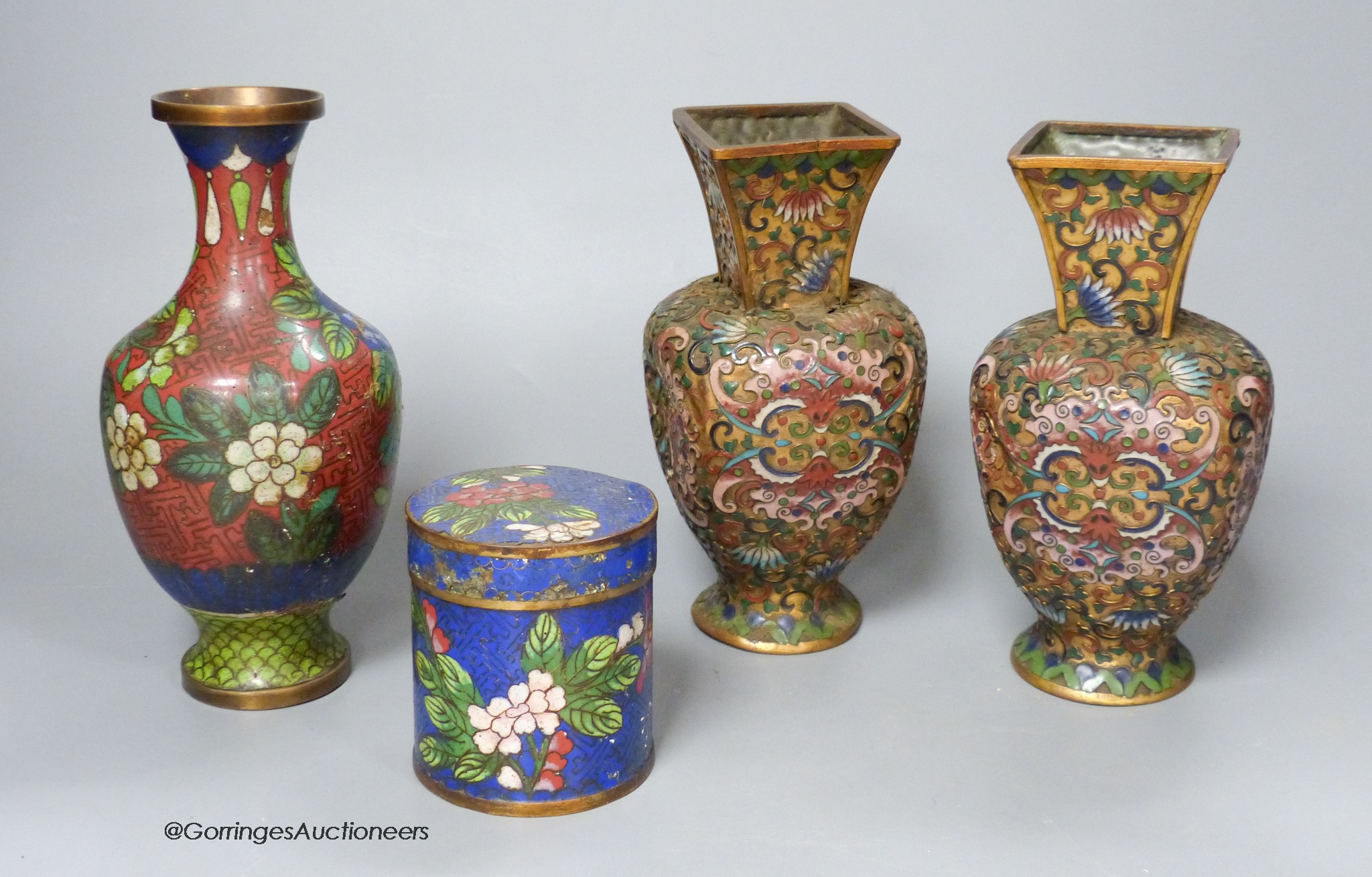 A pair of Chinese gilt ground cloisonné enamel vases, 16cm high a similar jar and cover                                                                                                                                     