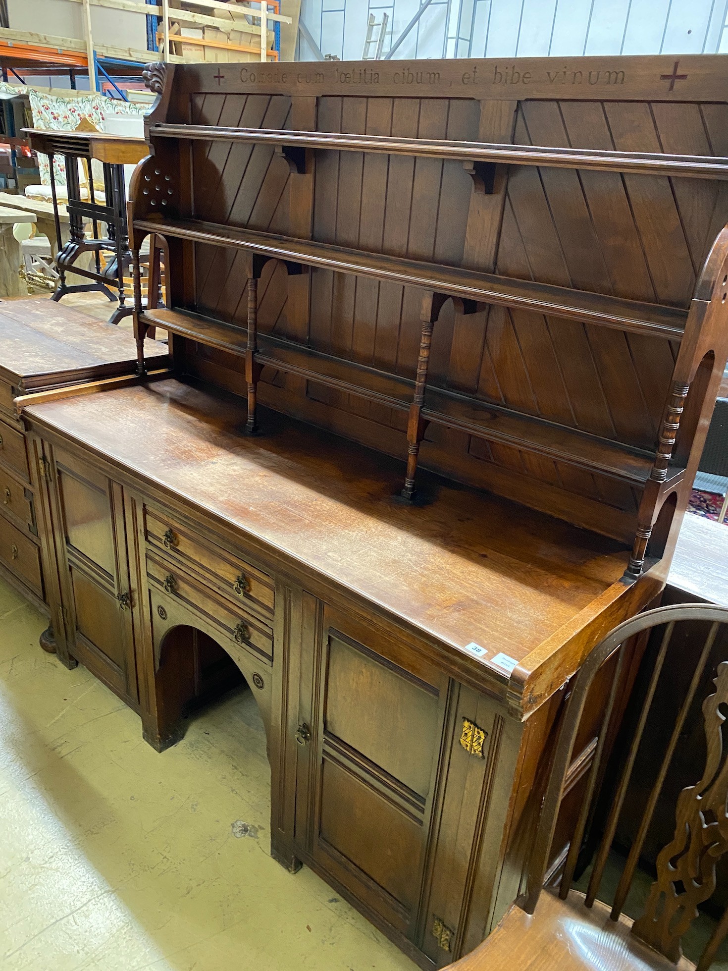 A Victorian aesthetic movement mahogany sideboard, with Latin motto to the freize, width 168cm, depth 60cm, height 182cm                                                                                                    