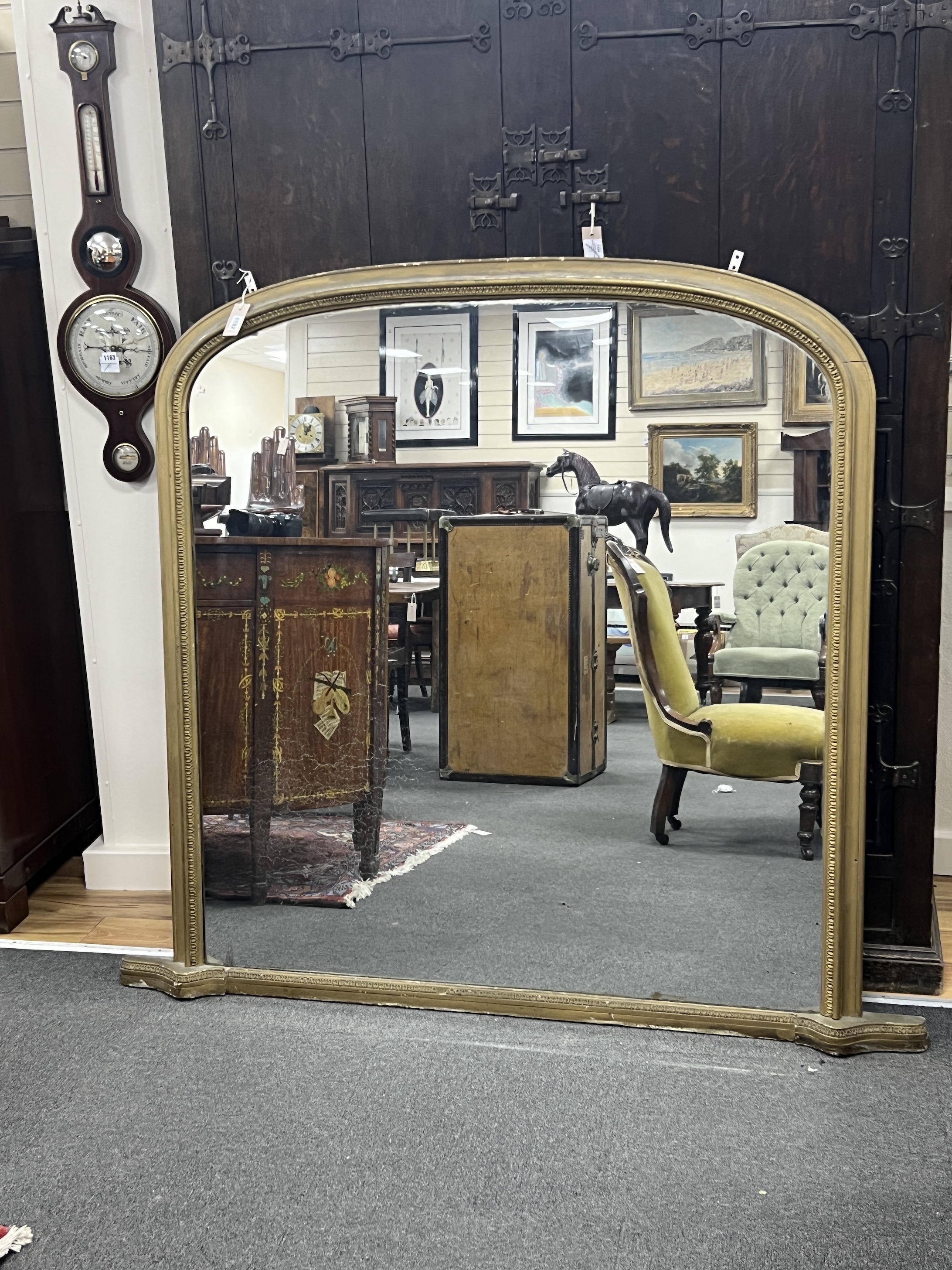 A Victorian giltwood and composition overmantel mirror, width 160cm, height 144cm                                                                                                                                           
