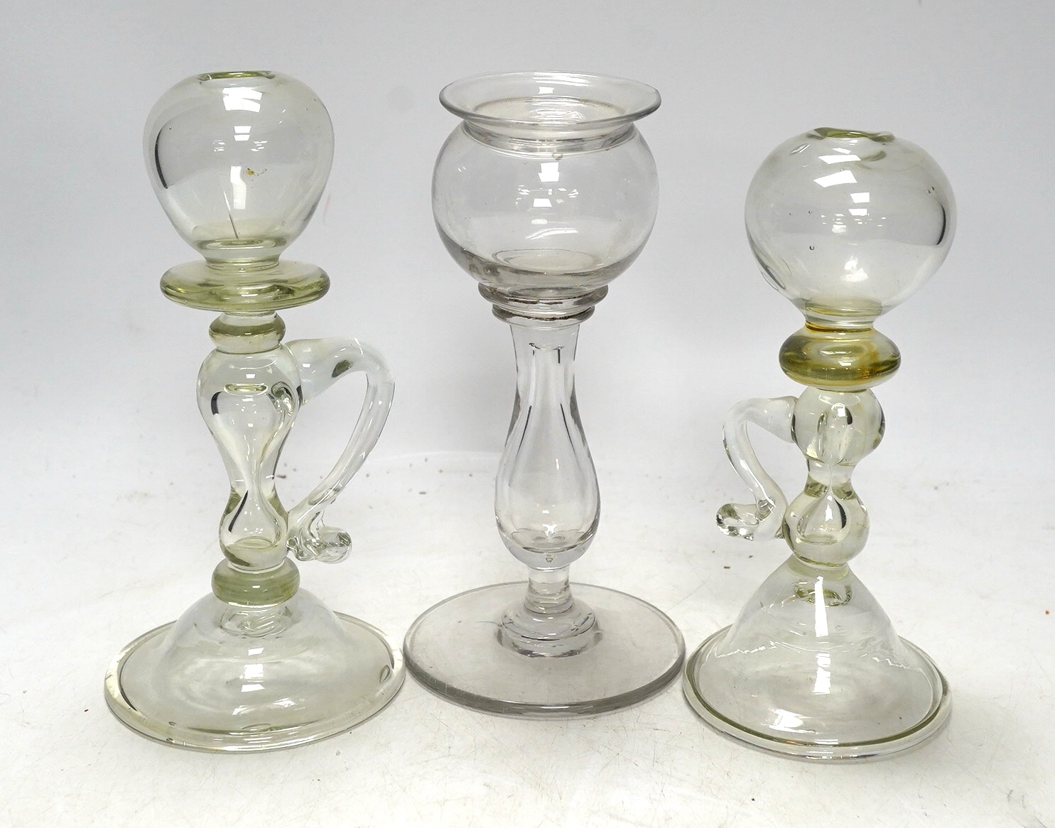 Three 18th century glass lacemaker's lamps, tallest 18cm. Condition - good                                                                                                                                                  