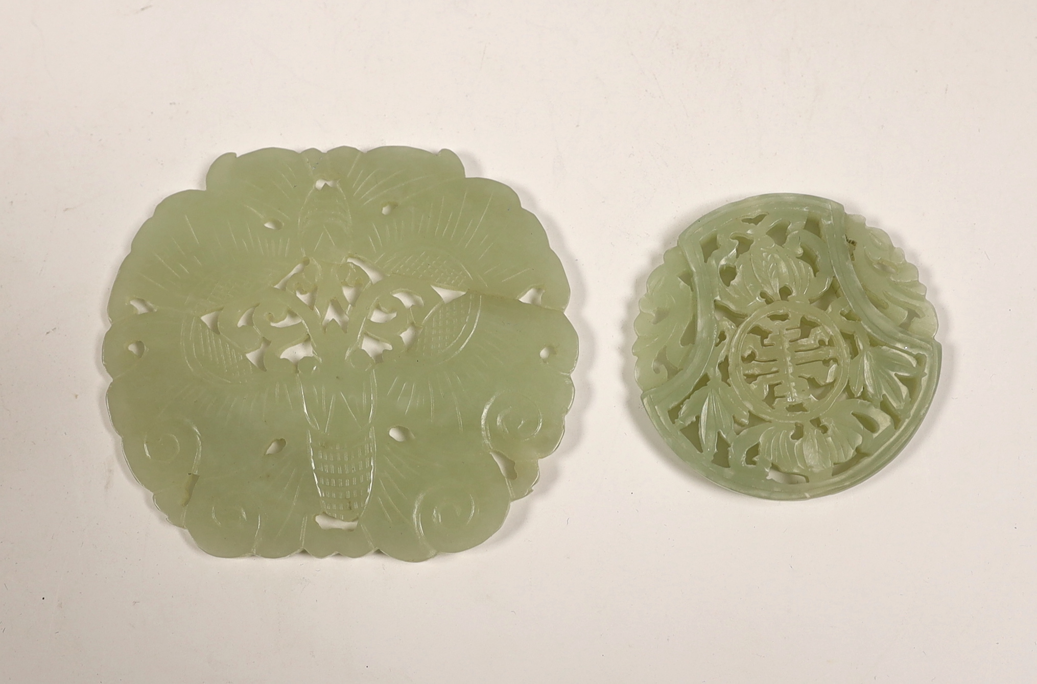 Two Chinese pale celadon jade plaques, largest 8cm                                                                                                                                                                          