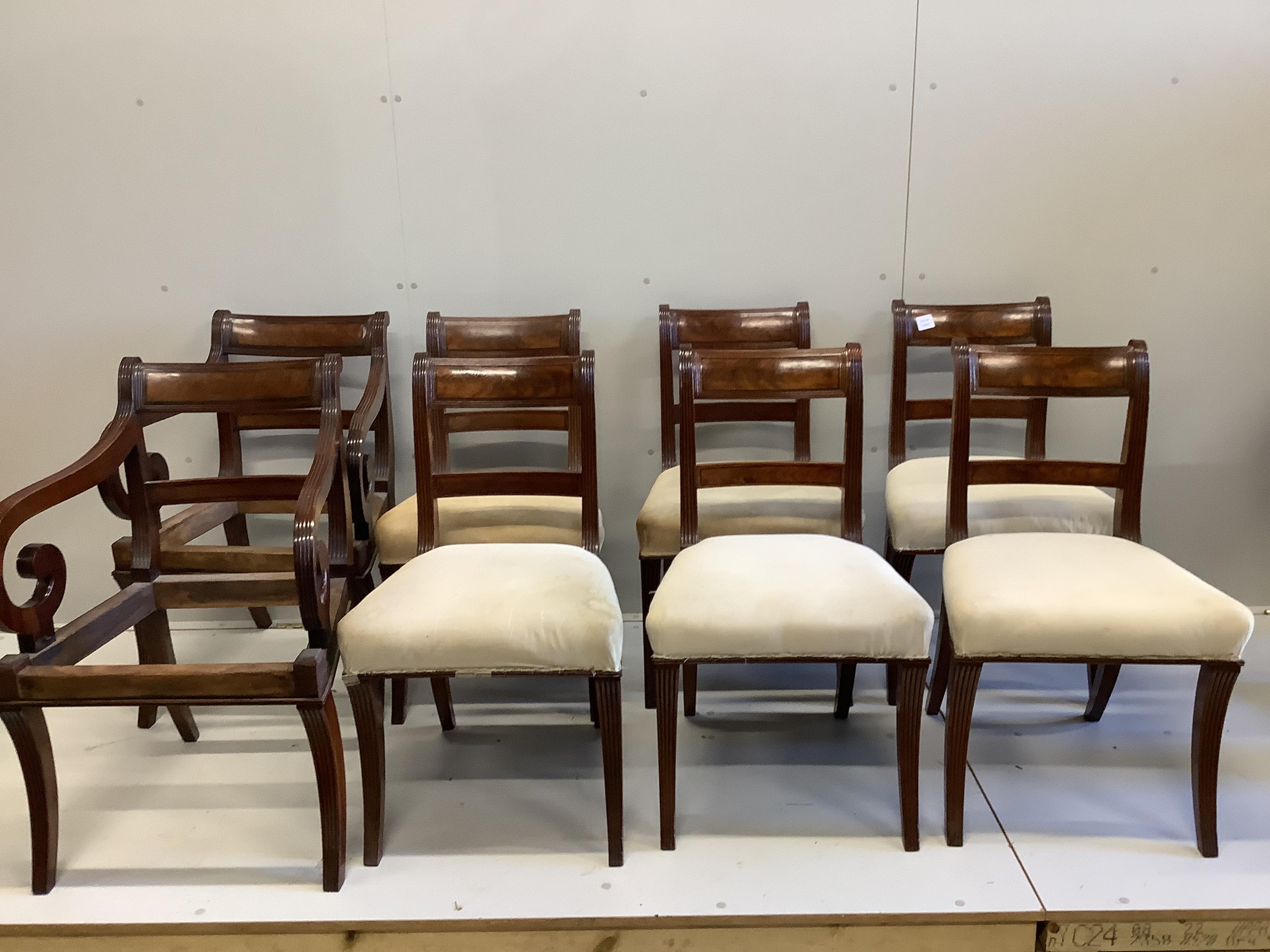 A set of six Regency mahogany dining chairs and two later elbow chairs lacking upholstery                                                                                                                                   