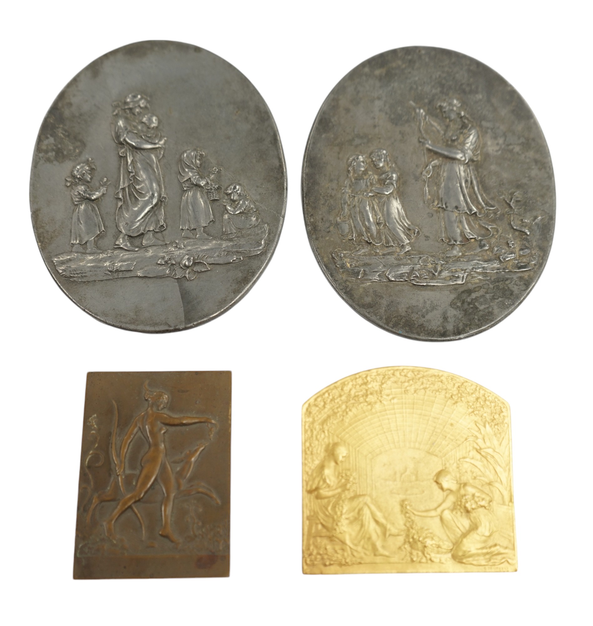 A pair of oval cast pewter plaques inscribed L. Jewitt, Duffield, and two relief-moulded brass plaques, signed Sporrong, Stockholm and G. De Vreese, oval plaques 13cm high. Condition - some marks to surface              