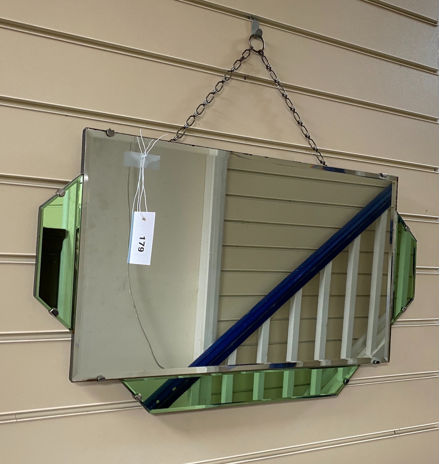 An Art Deco style green and clear glass wall mirror, width 66cm, height 38cm                                                                                                                                                