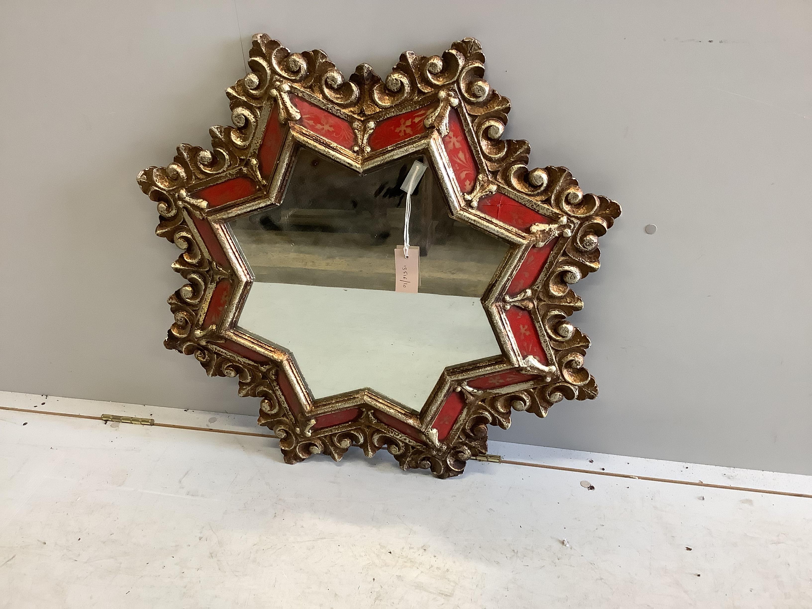 A giltwood and composition star shaped wall mirror, width 78cm                                                                                                                                                              