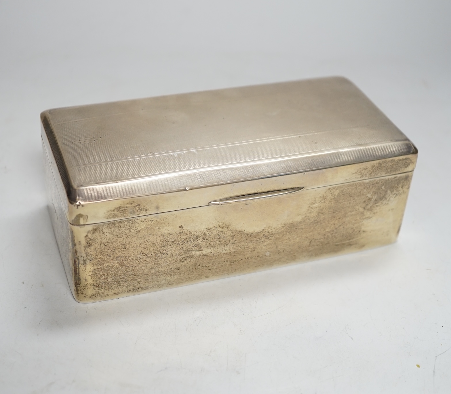 A George V Art Deco silver mounted rectangular cigarette box, Birmingham, 1930?, 17.5cm.                                                                                                                                    