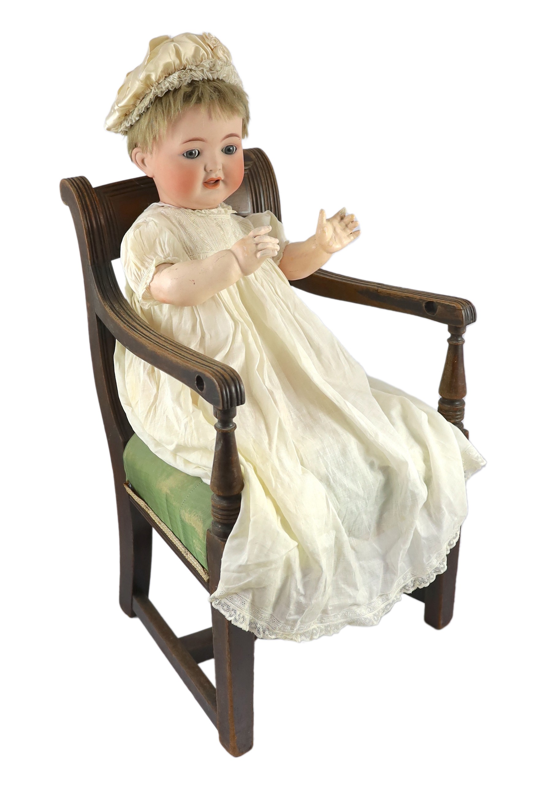 A Kammer & Reinhardt / Simon & Halbig bisque character doll, German, circa 1914, 20in. Please note the chair is for display purposes only.                                                                                  