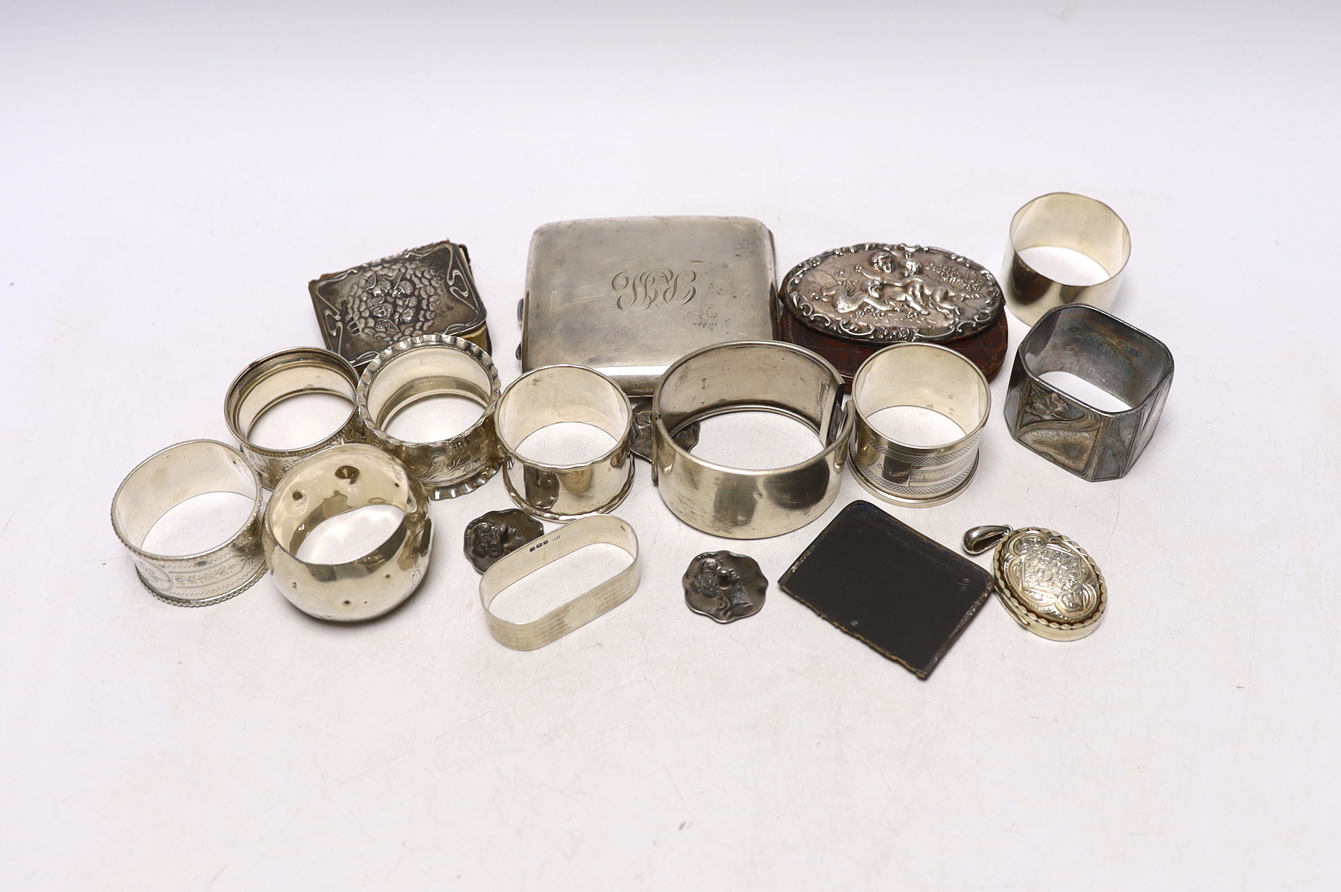 Sundry small silver including napkin rings, cigarette case, buttons, etc. and a WMF Art Nouveau silver plated napkin ring.                                                                                                  