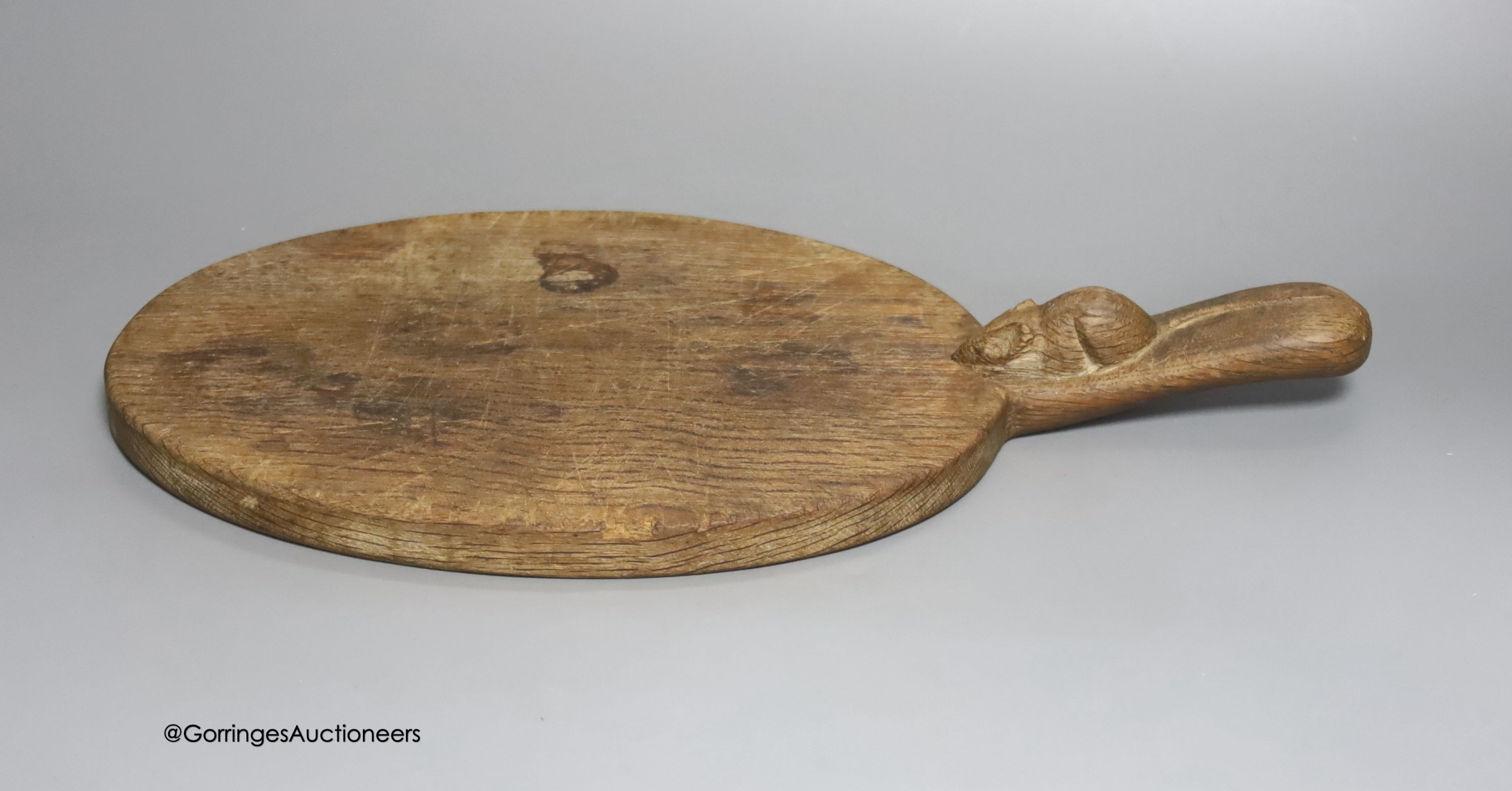 A Mouseman cheeseboard, length 38cm                                                                                                                                                                                         