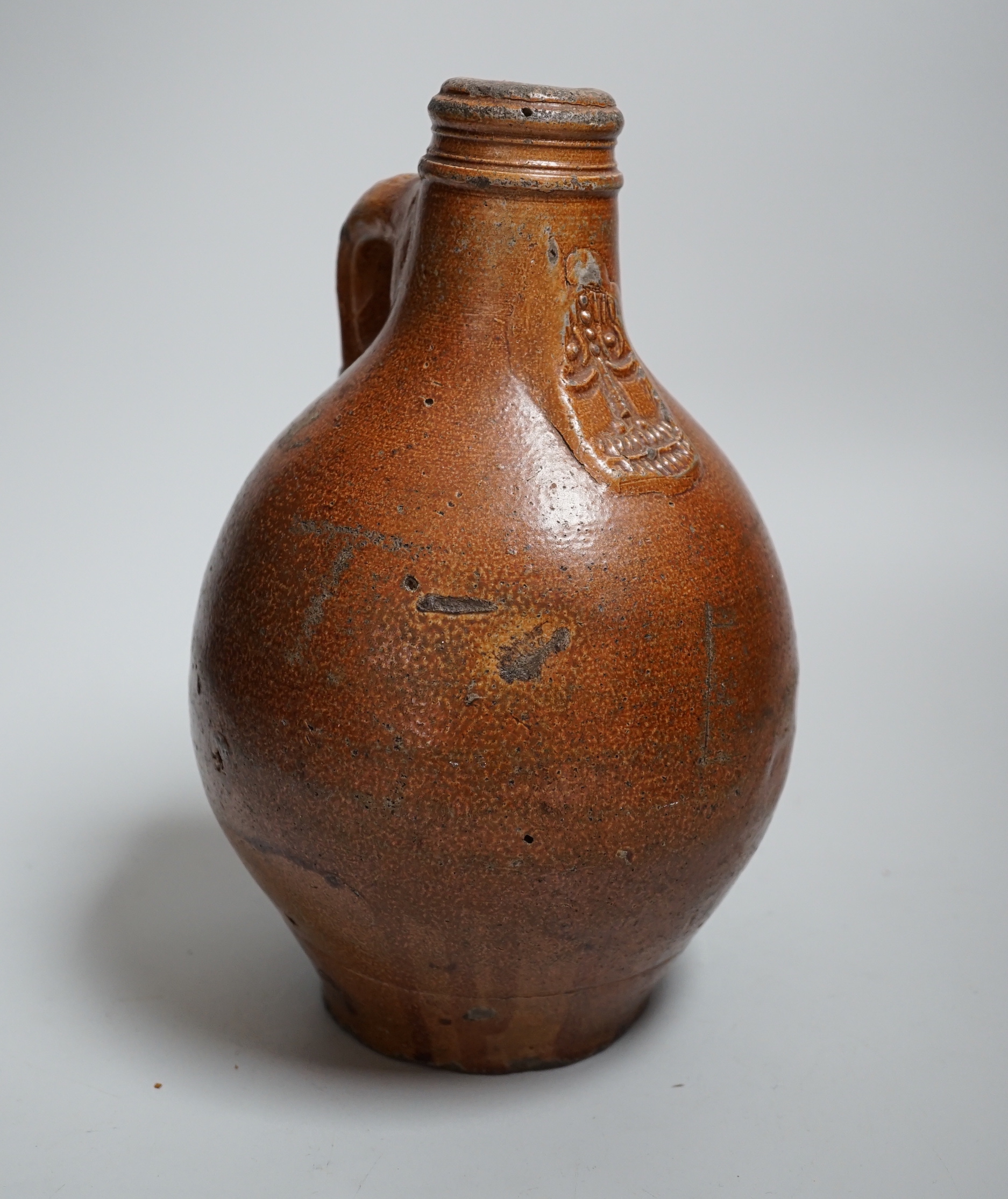 A 17th century stoneware Bellarmine or Bartmann jug, 23.5cm                                                                                                                                                                 