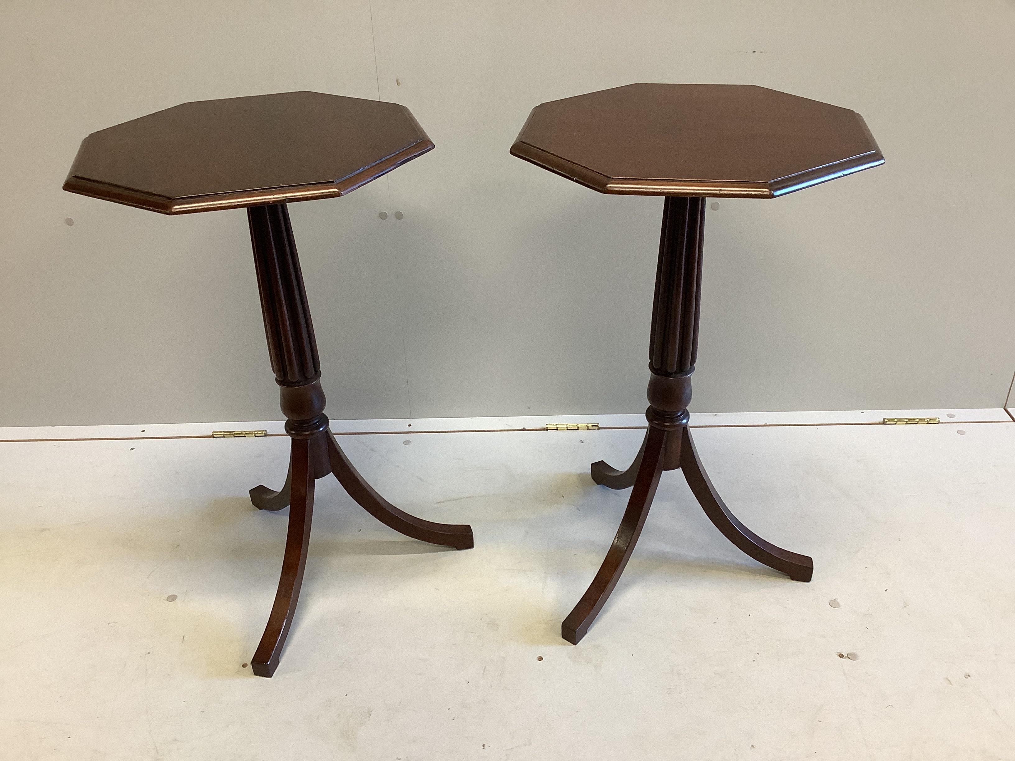 A pair of Regency style octagonal mahogany tripod wine tables, width 43cm, height 73cm                                                                                                                                      